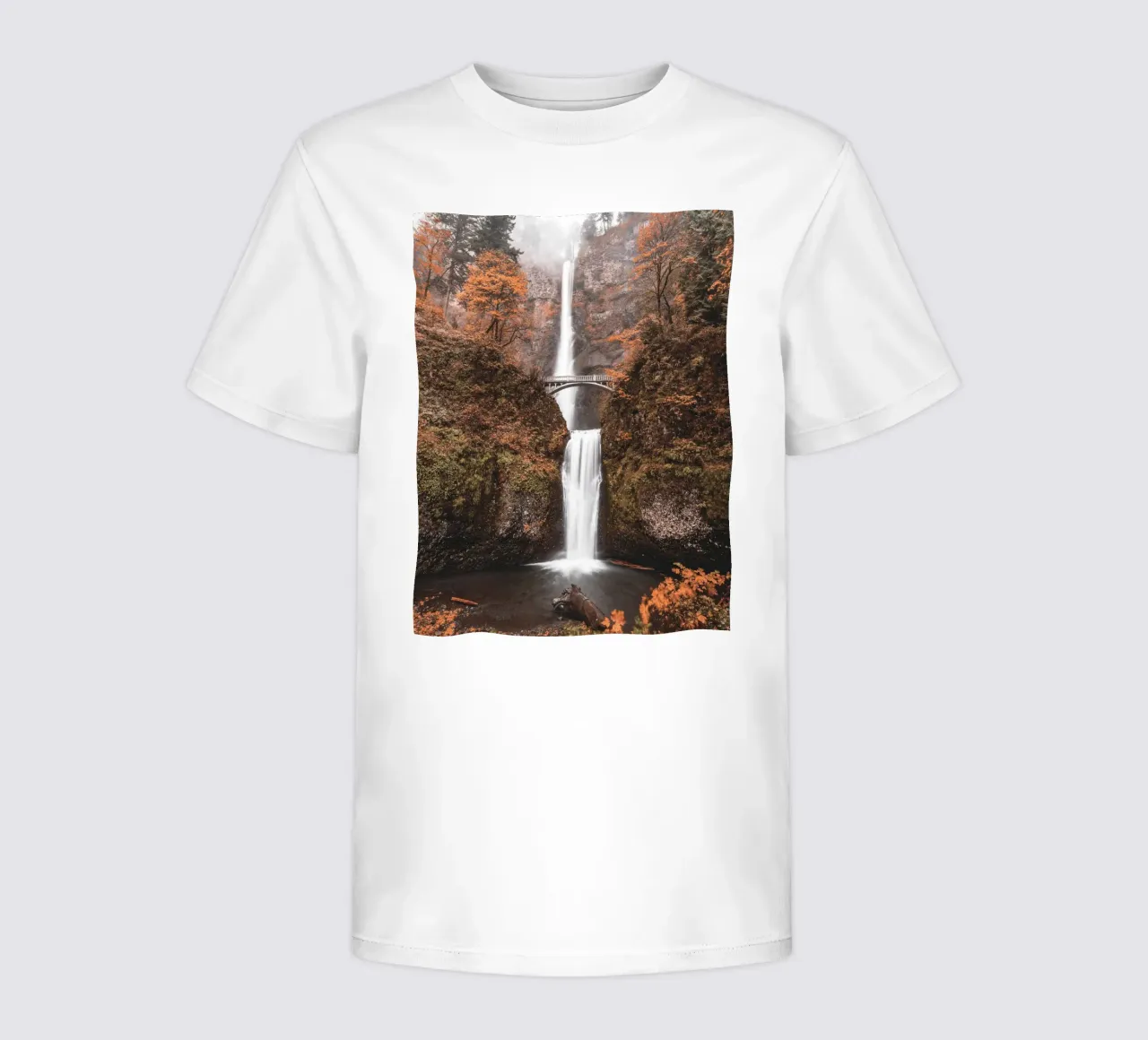 Autumnal waterfall with vintage-style bridge kids t-shirt by Whole©
