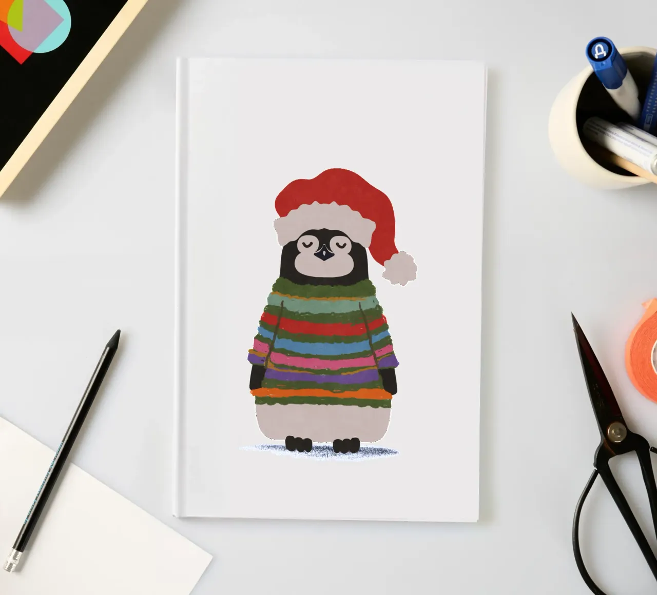 Weihnachtspinguin in Wollpullover notebook by Illustration Raissa Oltmanns