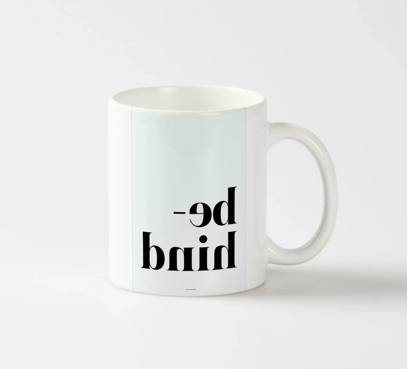 Behind ceramic mug by The Wall Shop