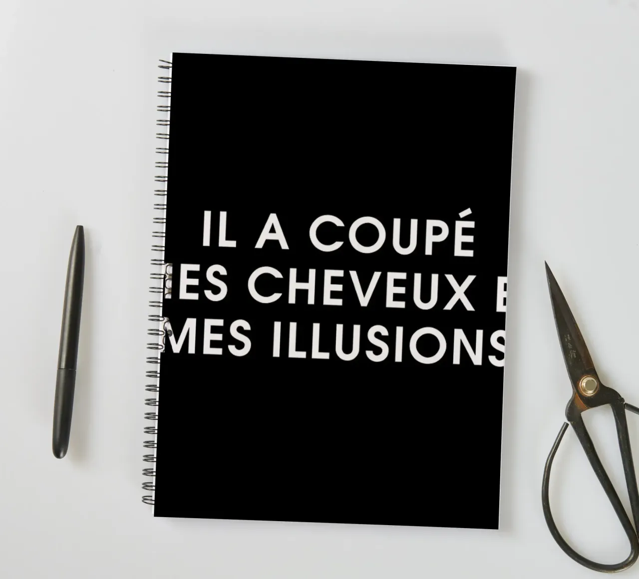Il a coupé mes cheveux et mes illusions - Black spiral notebook by Intertitres