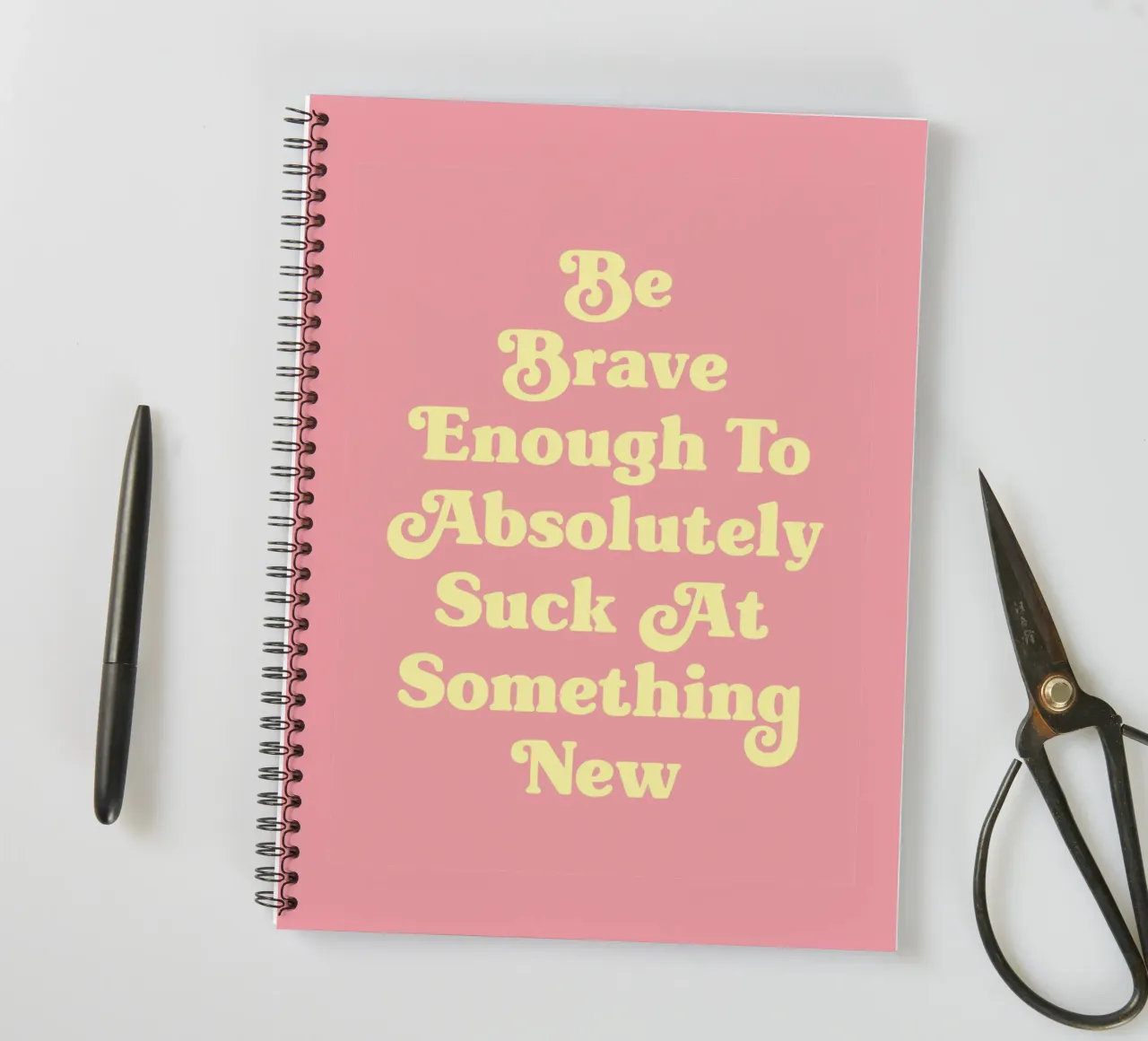 Be Brave Enough To Absolutely Suck at something new quote spiral notebook by Paigaam Studio