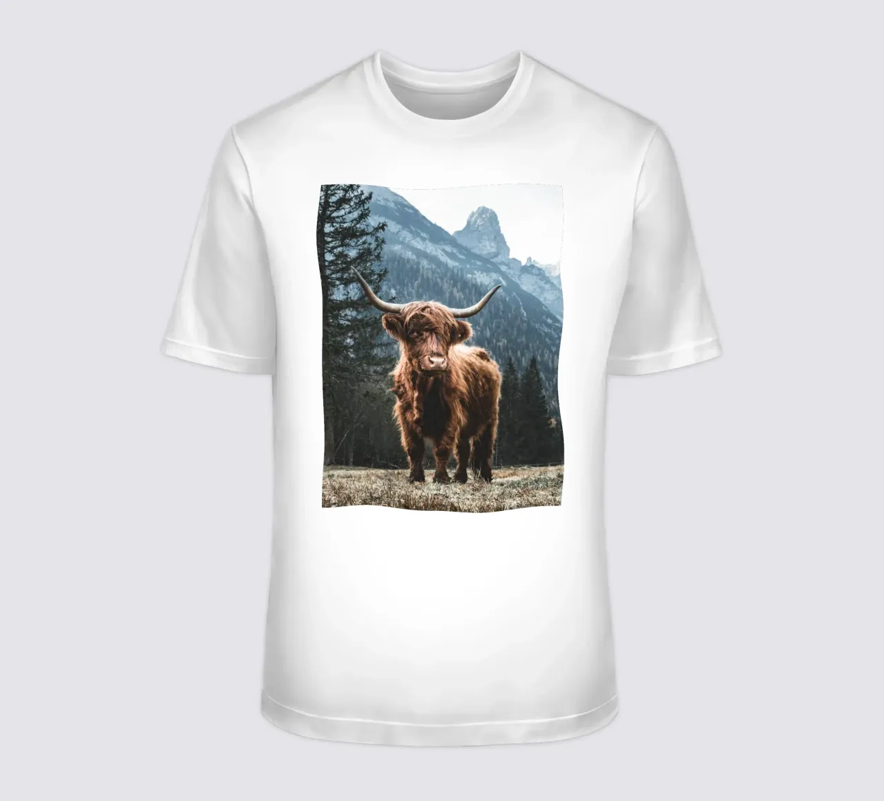 Highland cow in front of a mountain backdrop - Rustic nature photography t-shirt by Whole©