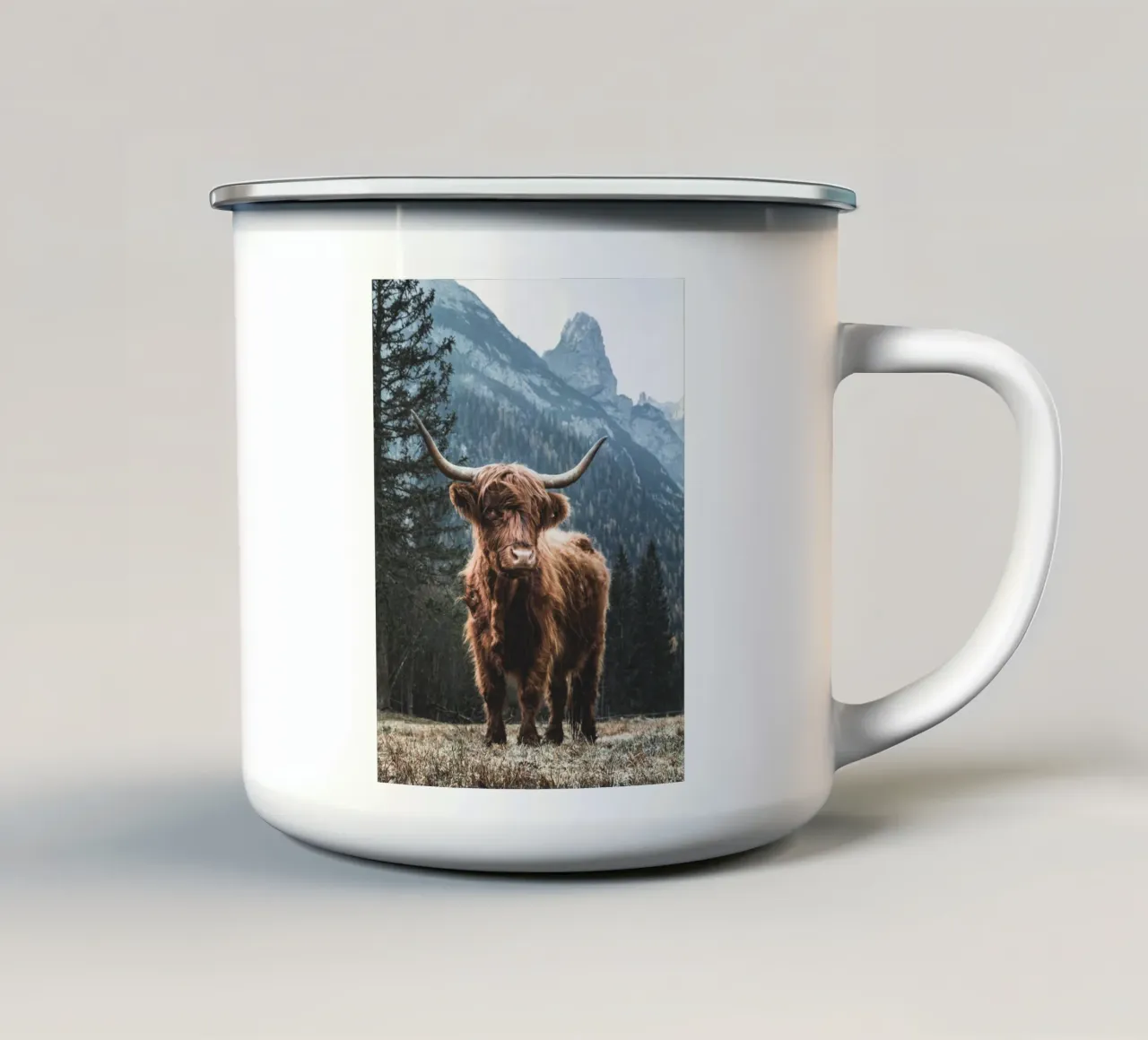 Highland cow in front of a mountain backdrop - Rustic nature photography enamel mug by Whole©
