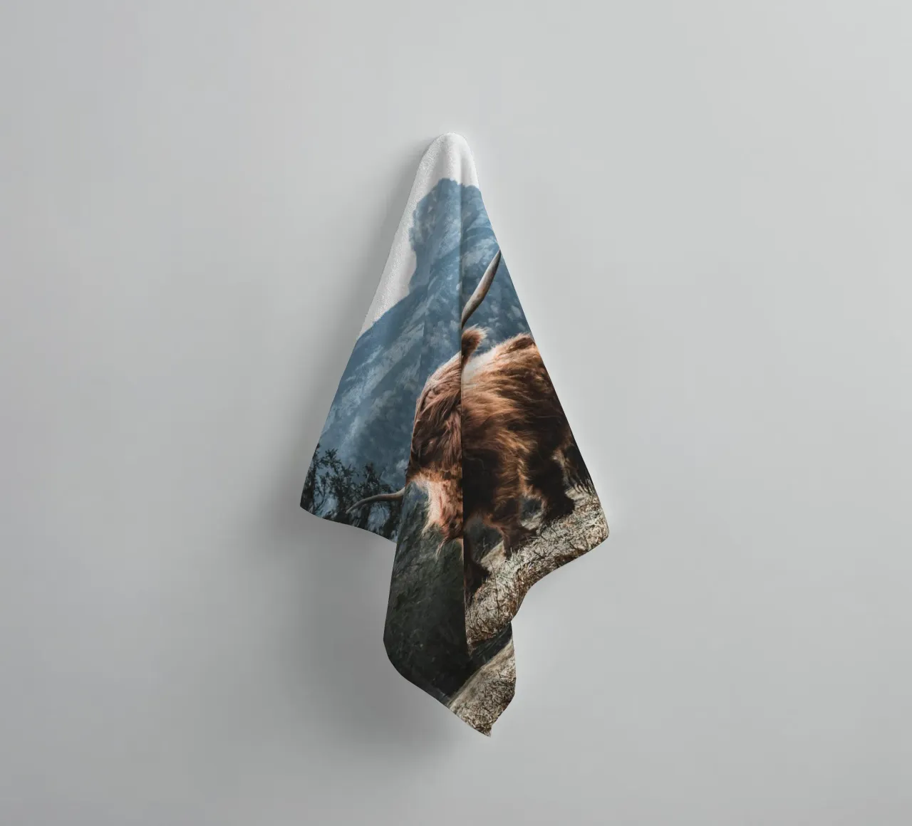 Highland cow in front of a mountain backdrop - Rustic nature photography towel by Whole©