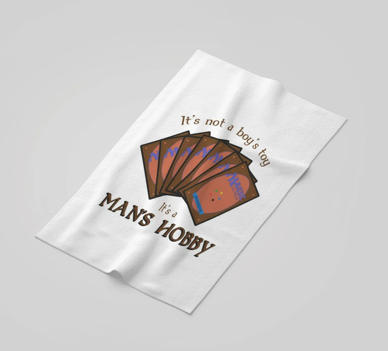 Magic it's not a boy's toy. It's a man's hobby beach towel by Loobs