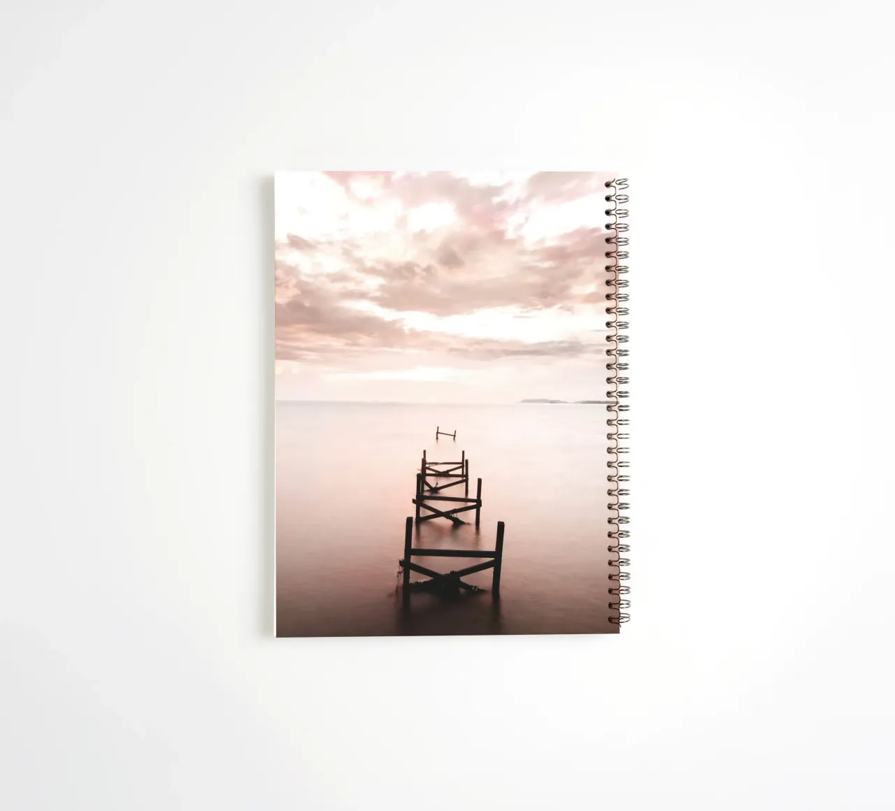 Abandoned jetty at sunset - Quiet coastal motif spiral notebook by Whole©