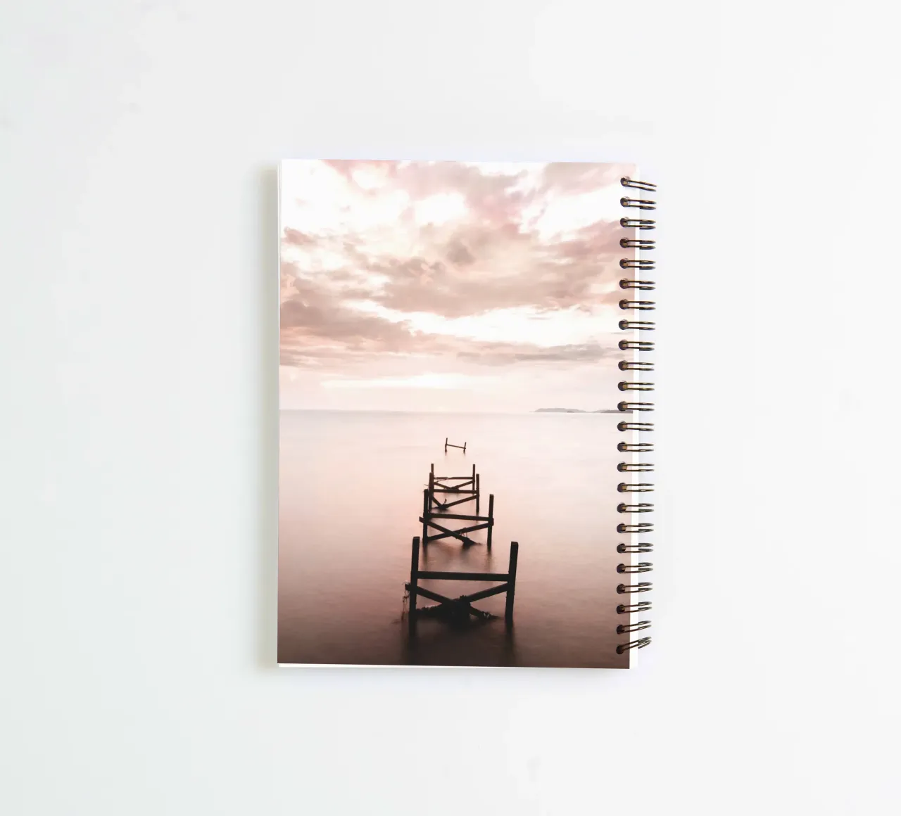 Abandoned jetty at sunset - Quiet coastal motif spiral notebook by Whole©