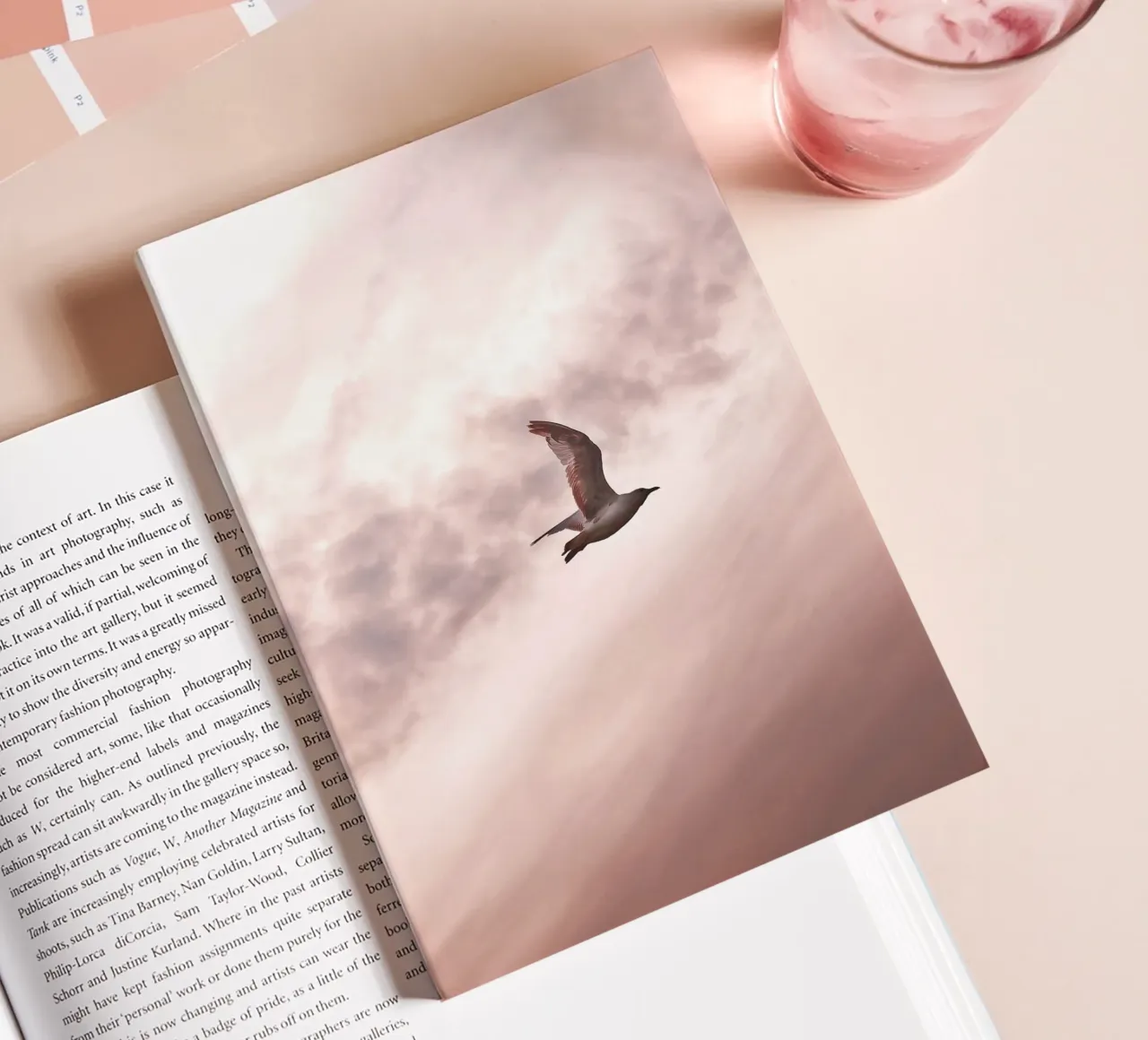 Freedom in flight - seagull in front of a rosy sky notebook by Whole©