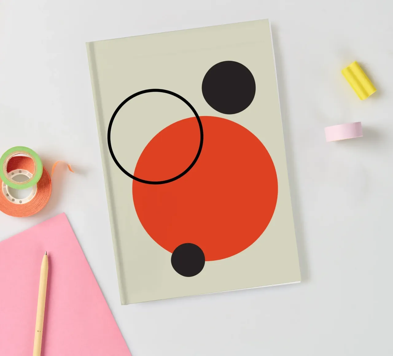Abstract design of circles in red, beige and black notebook by Lisa Jureczko Arts Illustration