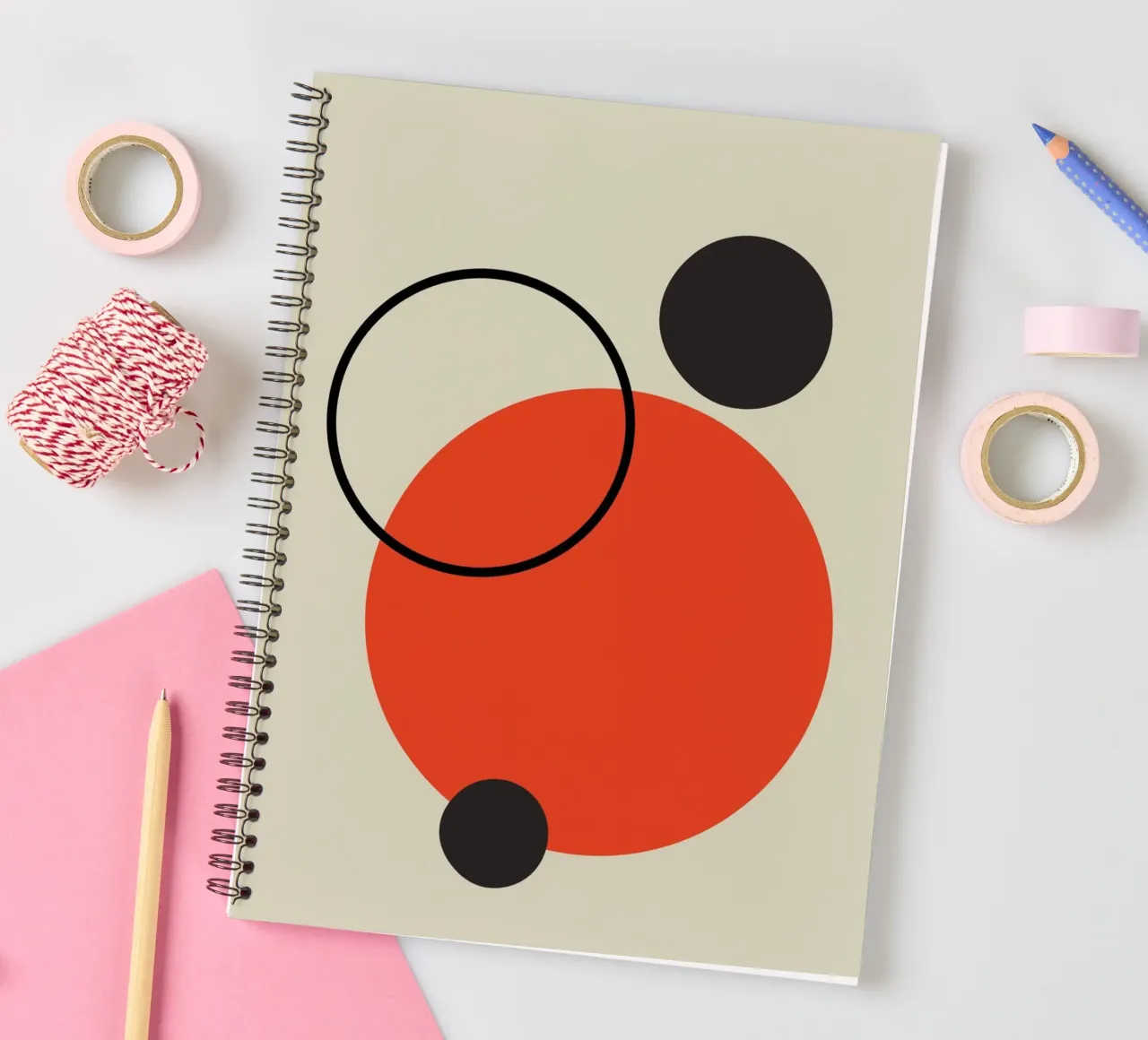 Abstract design of circles in red, beige and black spiral notebook by Lisa Jureczko Arts Illustration