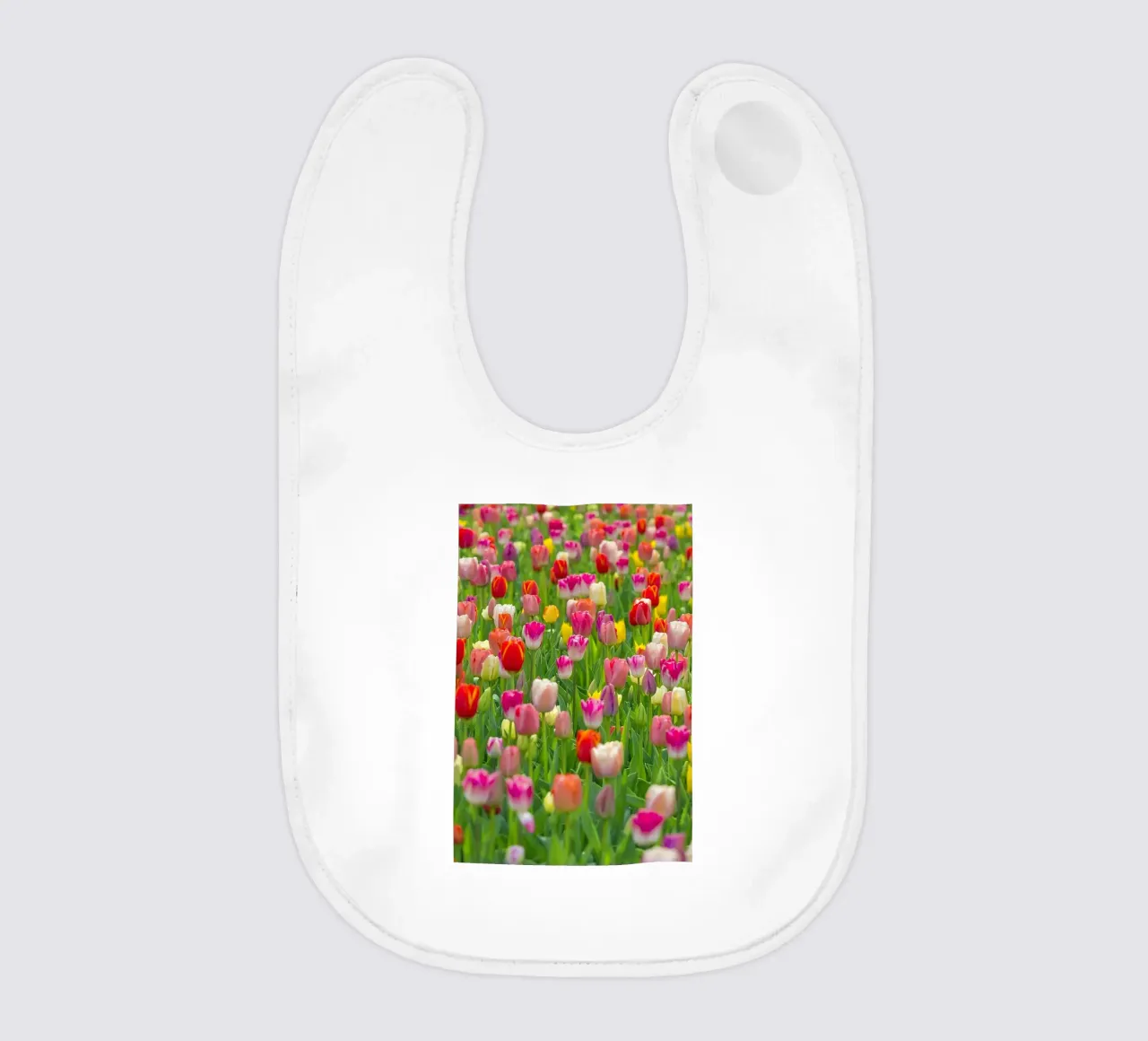 A Symphony of Color: Mixed Tulips in Bloom baby bib by Curious Collections by Marielle Leenders