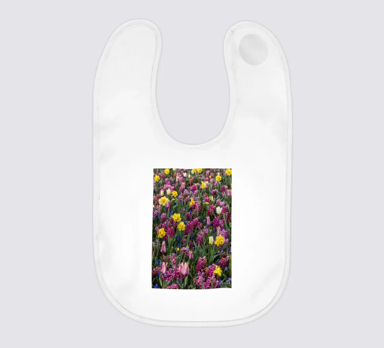 A Symphony of Spring: Purple Tulips, Hyacinths, and Daffodil baby bib by Curious Collections by Marielle Leenders