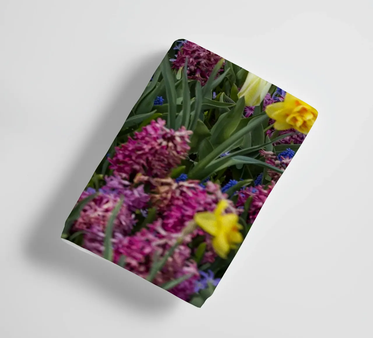 A Symphony of Spring: Purple Tulips, Hyacinths, and Daffodil towel by Curious Collections by Marielle Leenders