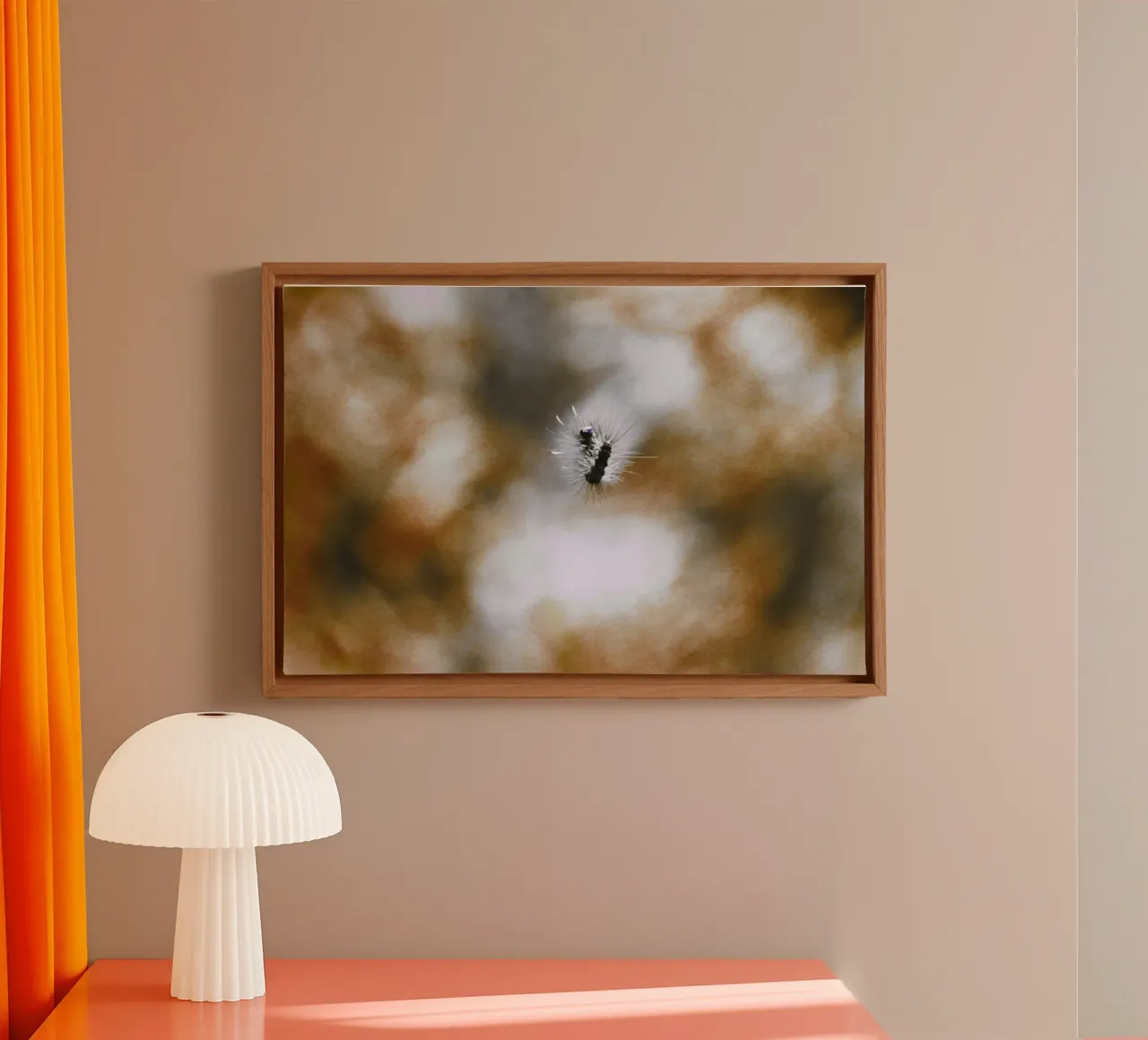 Black, floating caterpillar in front of brown background, analogue canvas with Floater frame by Lisa Jureczko Arts Illustration