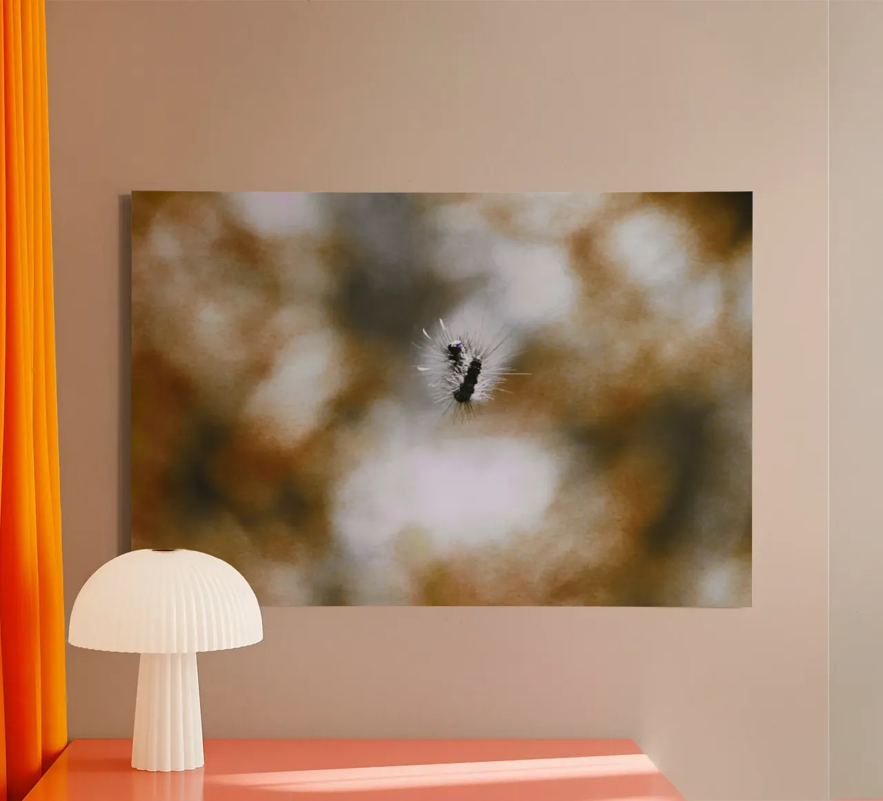 Black, floating caterpillar in front of brown background, analogue canvas with Floater frame by Lisa Jureczko Arts Illustration
