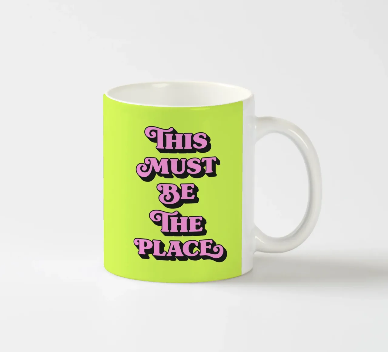 This must be the place (neon green tone) ceramic mug by Paigaam Studio