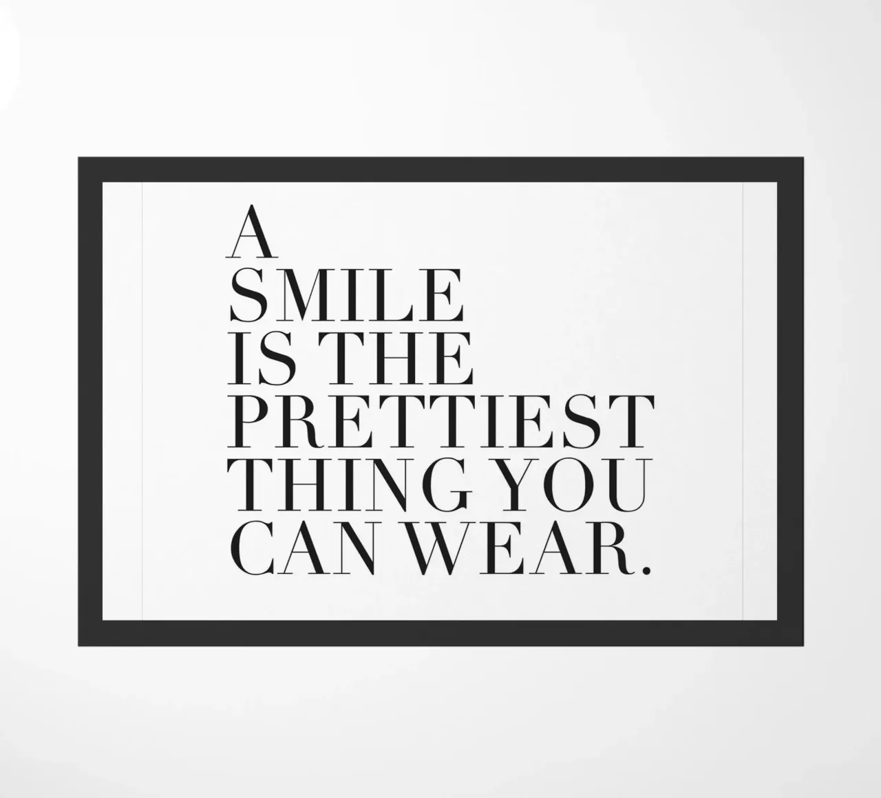 Inspirational poster - A Smile Is Prettiest doormat by Whole©
