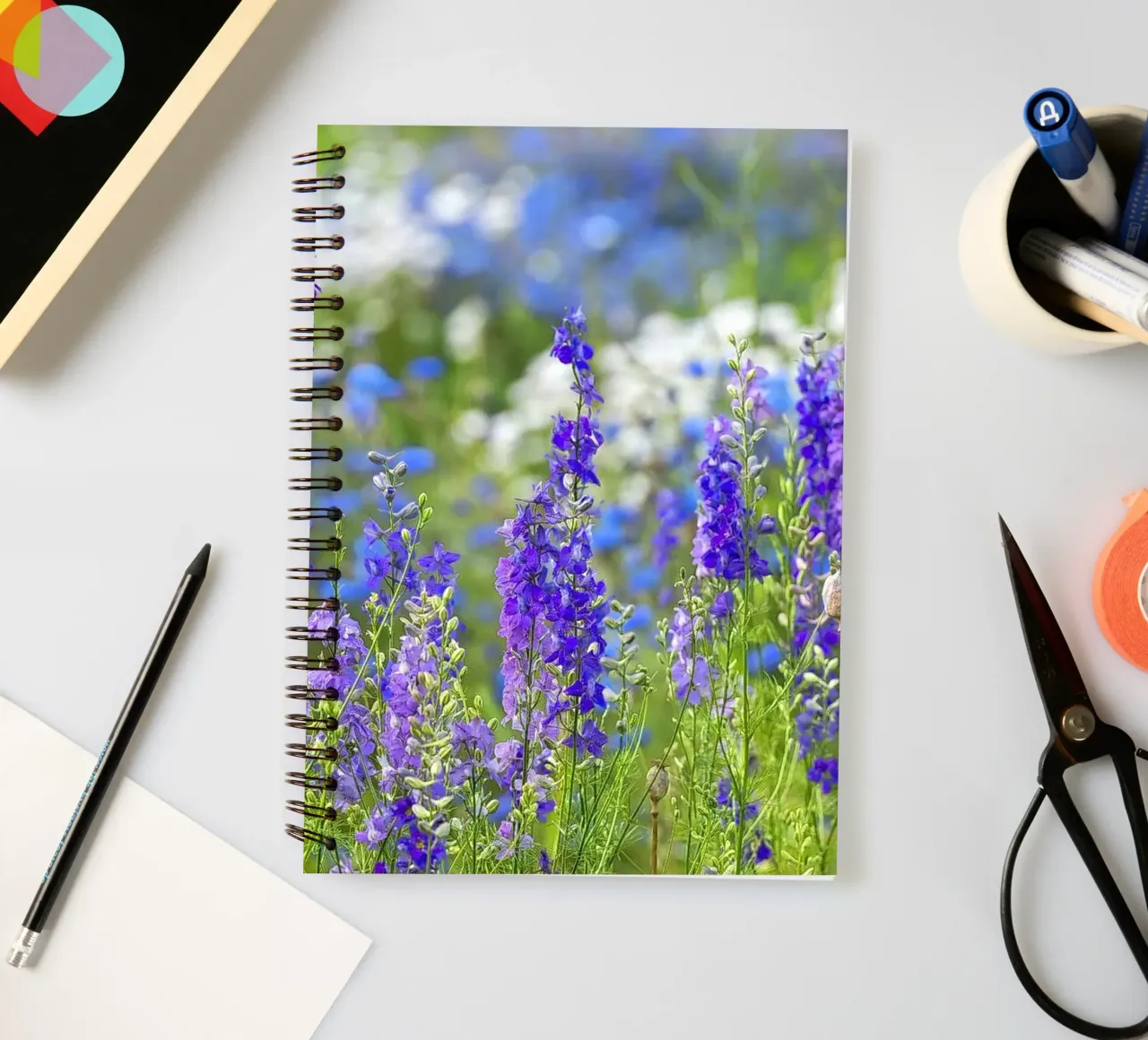 A Sea of Serenity: Purple Delphinium Field spiral notebook by Curious Collections by Marielle Leenders
