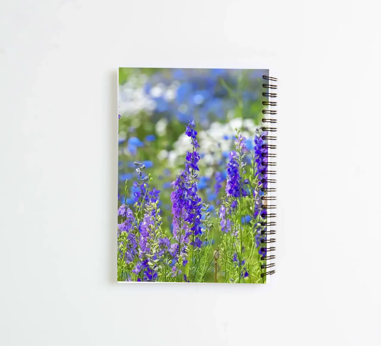 A Sea of Serenity: Purple Delphinium Field spiral notebook by Curious Collections by Marielle Leenders