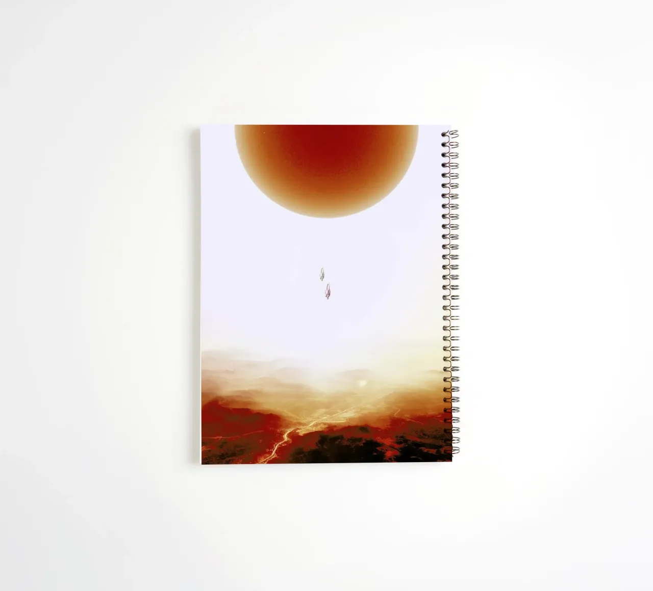 Descent of two skydivers over an alien red desert planet spiral notebook by Stoian Hitrov