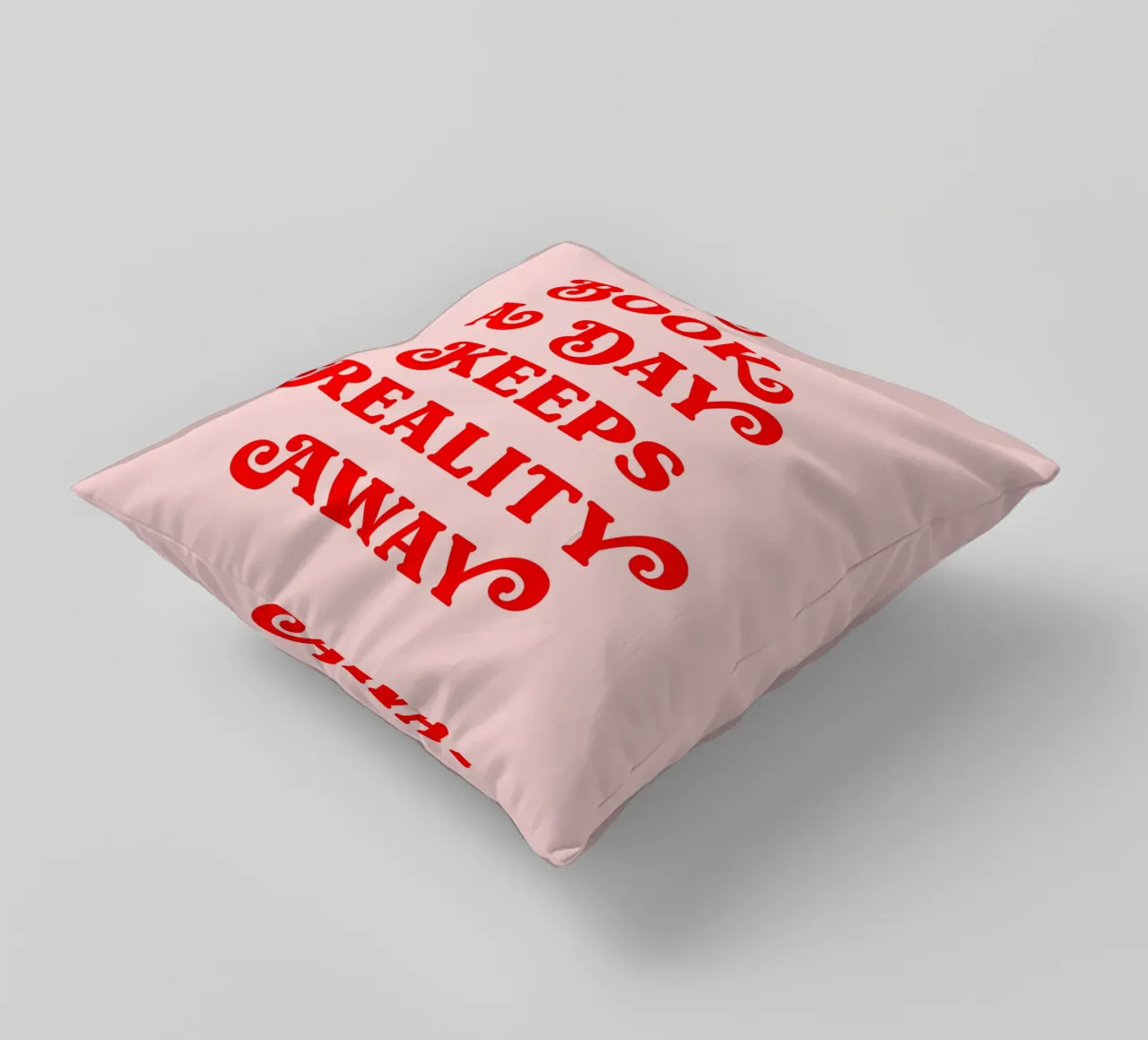 A book a day keeps reality away quote decorative cushion by Paigaam Studio