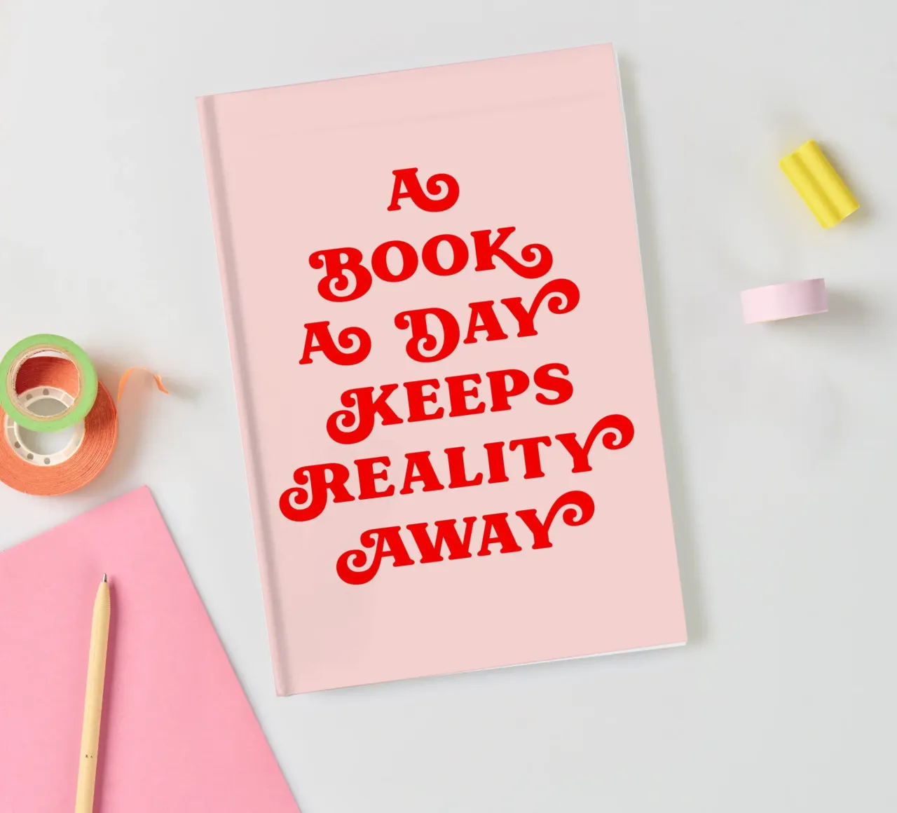 A book a day keeps reality away quote notebook by Paigaam Studio