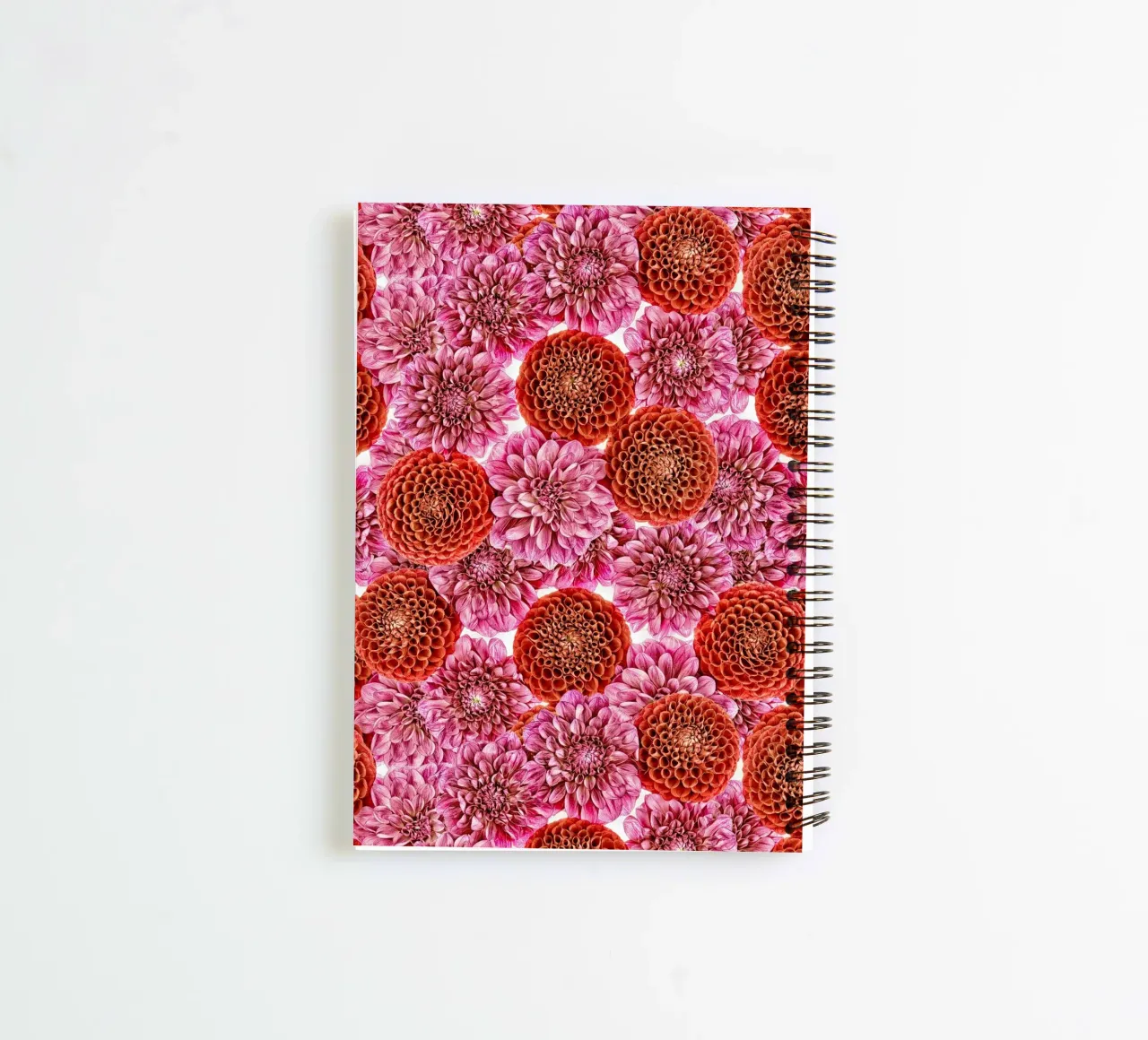 A floral tapestry of bold red and regal purple dahlias. spiral notebook by Curious Collections by Marielle Leenders
