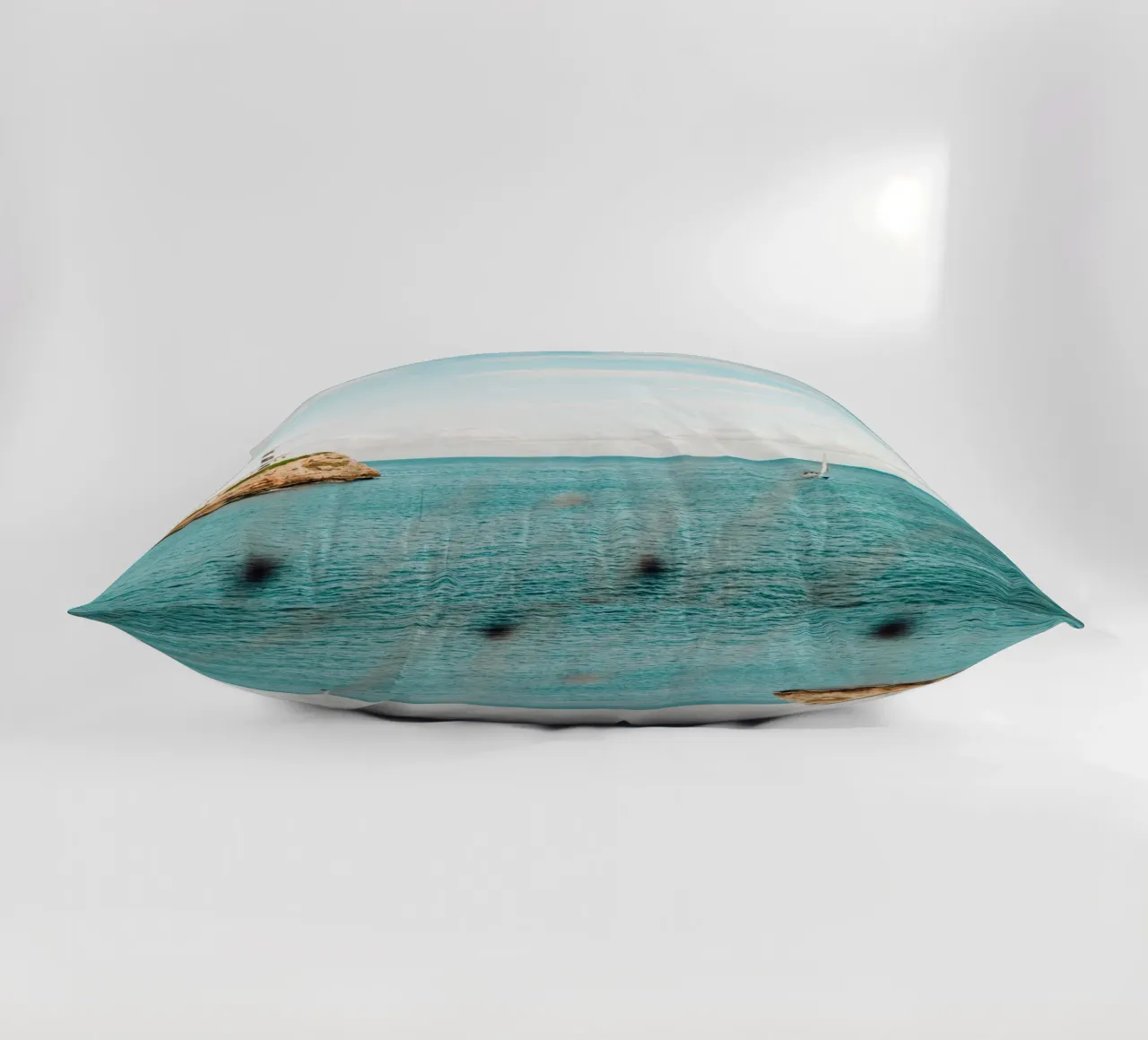 Lighthouse by the sea off Mallorca with sailing boat decorative cushion by Bold and Retro
