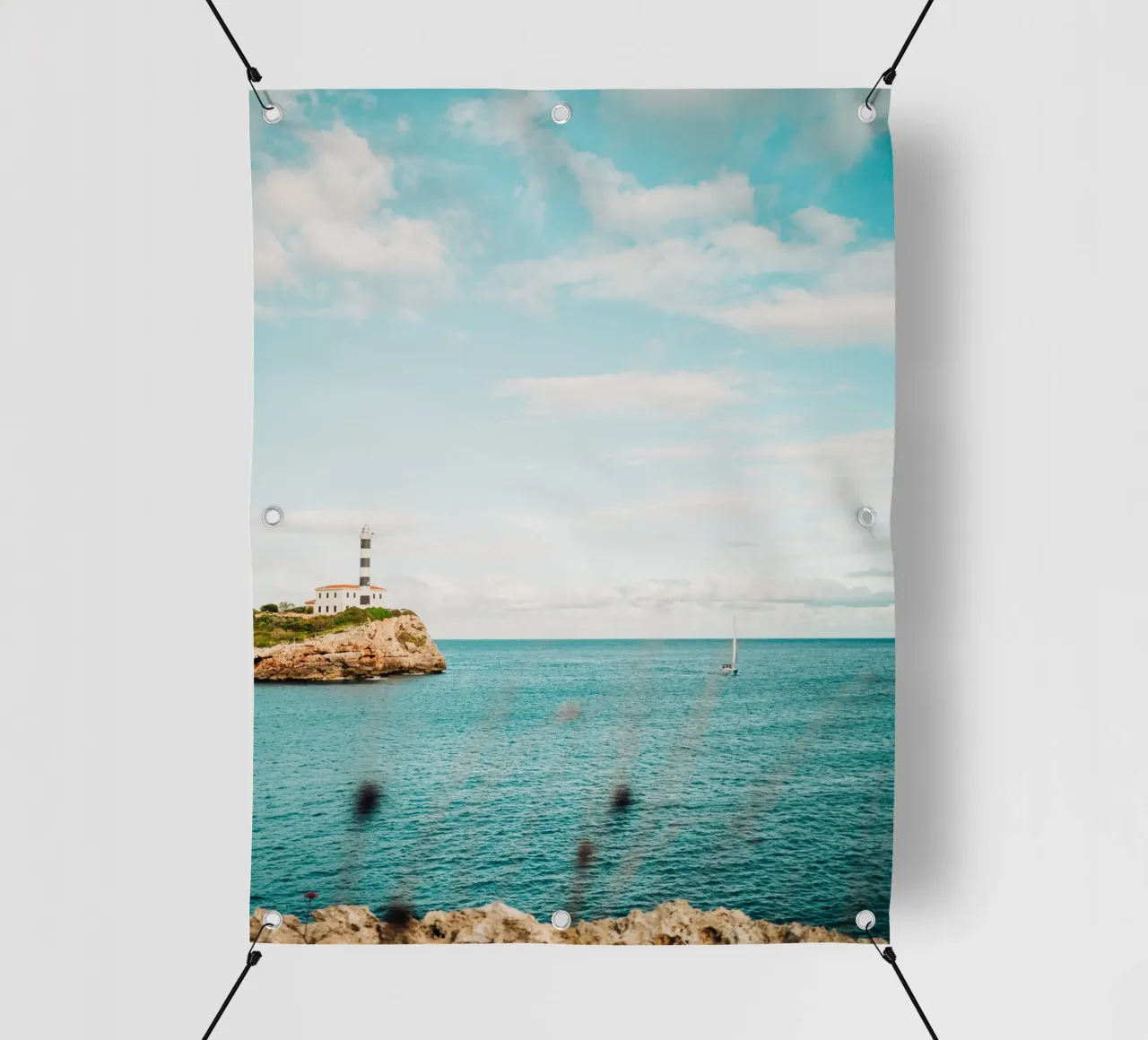Lighthouse by the sea off Mallorca with sailing boat pvc cover by Bold and Retro