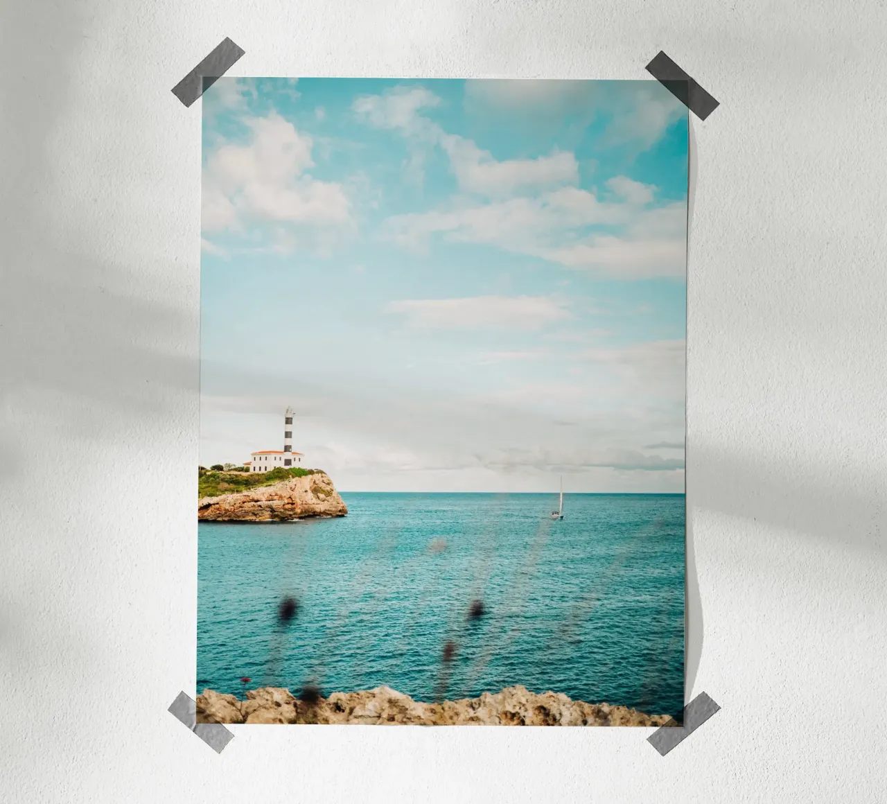 Lighthouse by the sea off Mallorca with sailing boat hahnemühle by Bold and Retro
