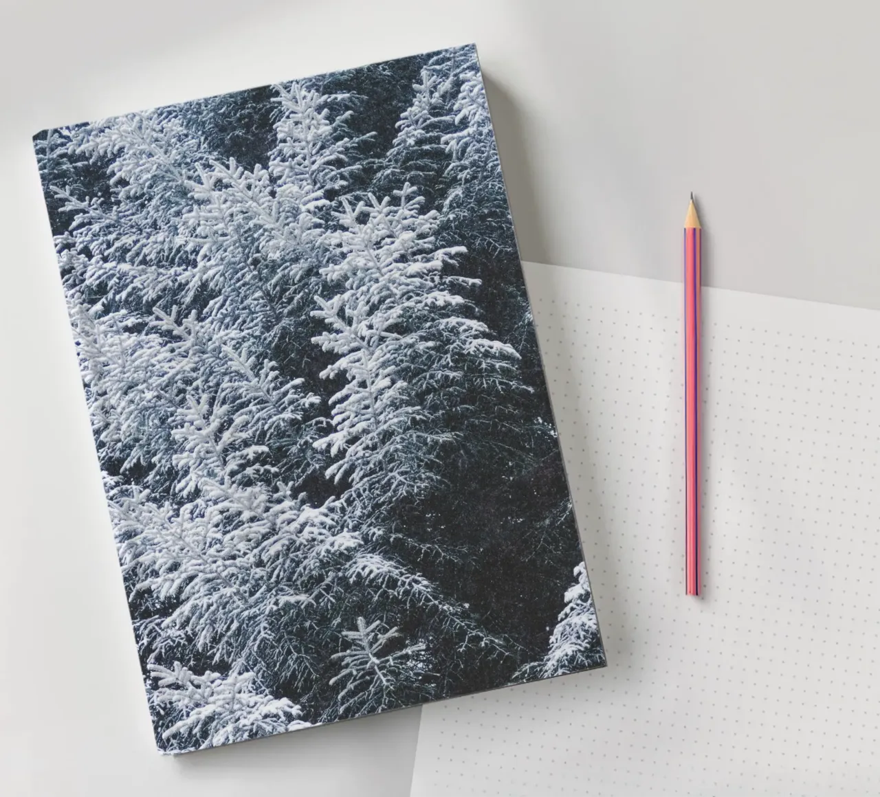 Snow-covered fir trees nature design notebook by Whole©