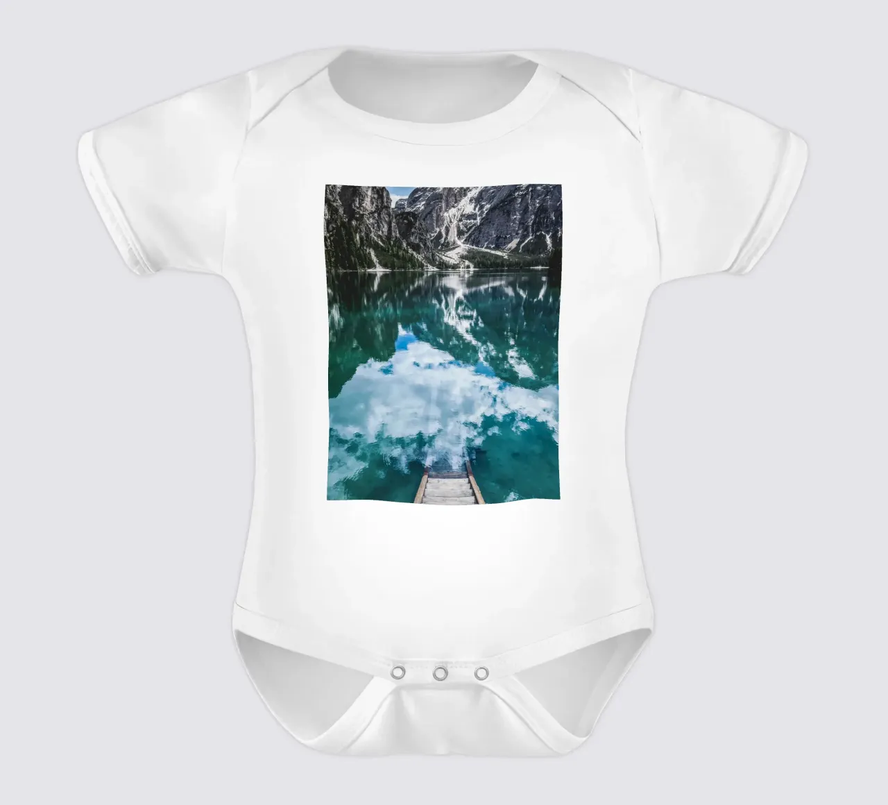 Reflecting mountain lake with jetty short-sleeve baby romper by Whole©