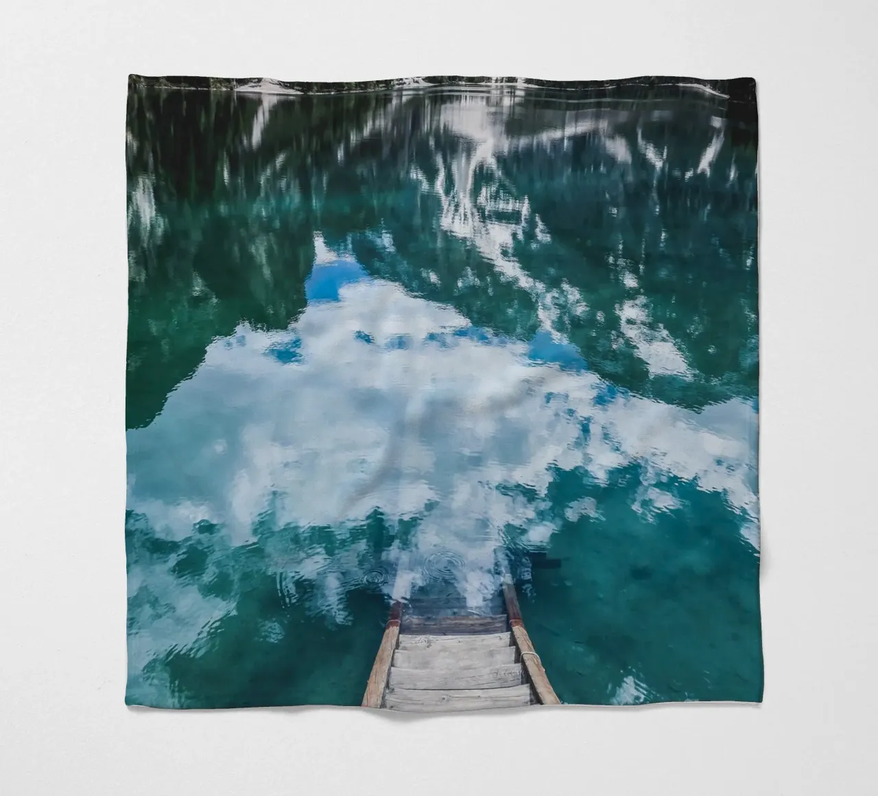 Reflecting mountain lake with jetty fleece blanket by Whole©