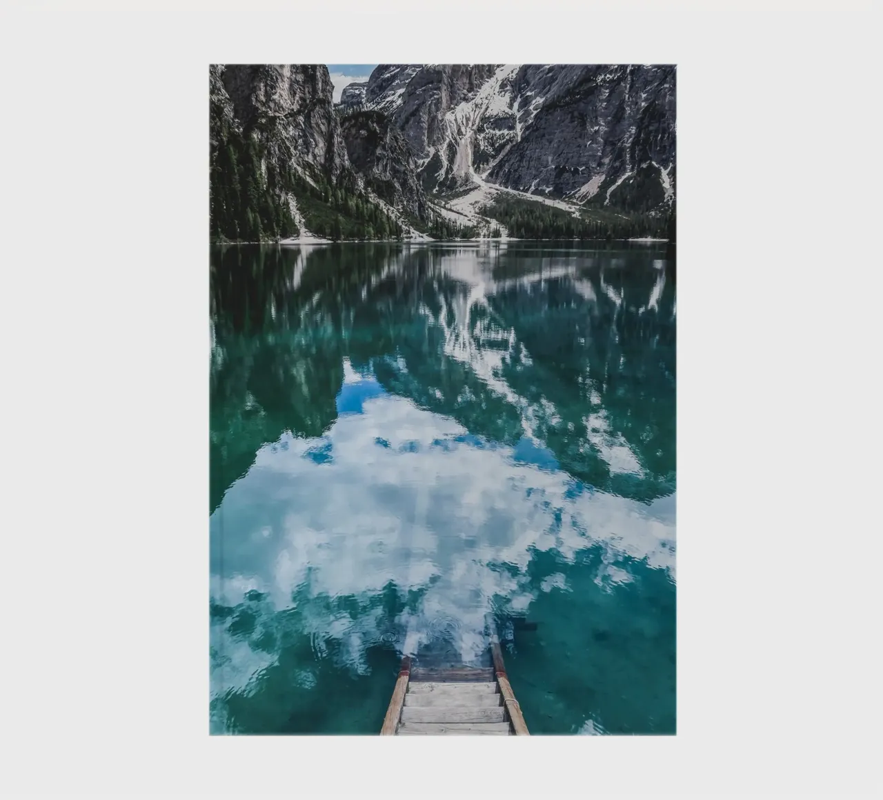 Reflecting mountain lake with jetty notebook by Whole©