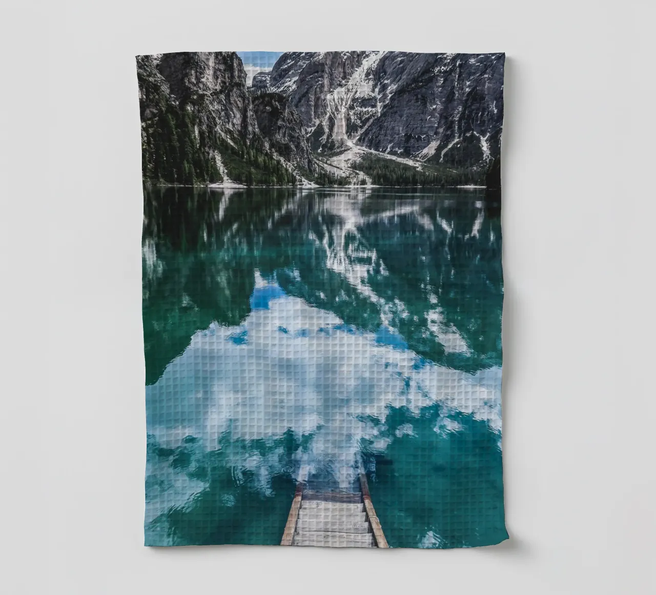 Reflecting mountain lake with jetty tea towel by Whole©