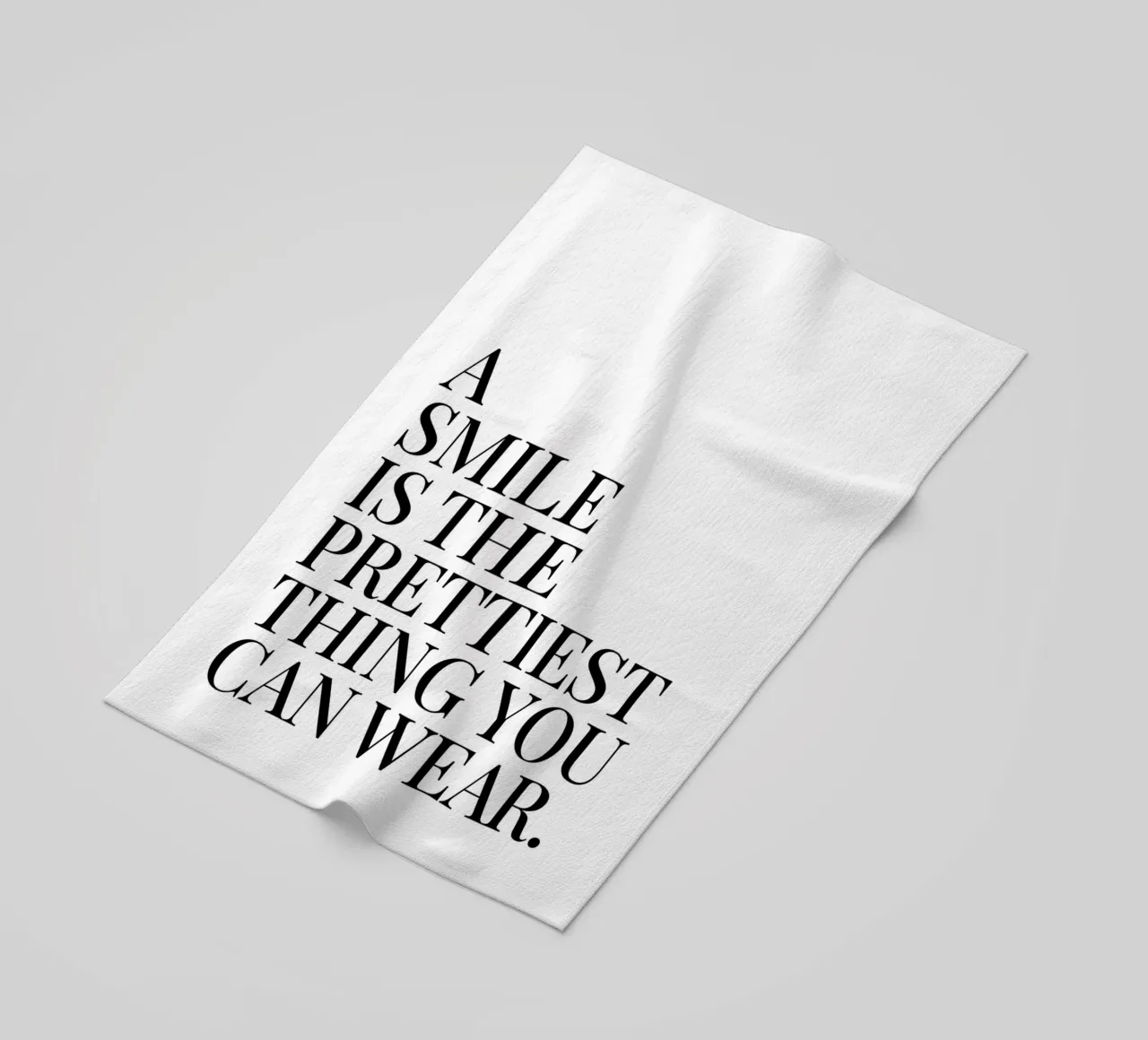A smile is the prettiest thing you can wear quote beach towel by Paigaam Studio