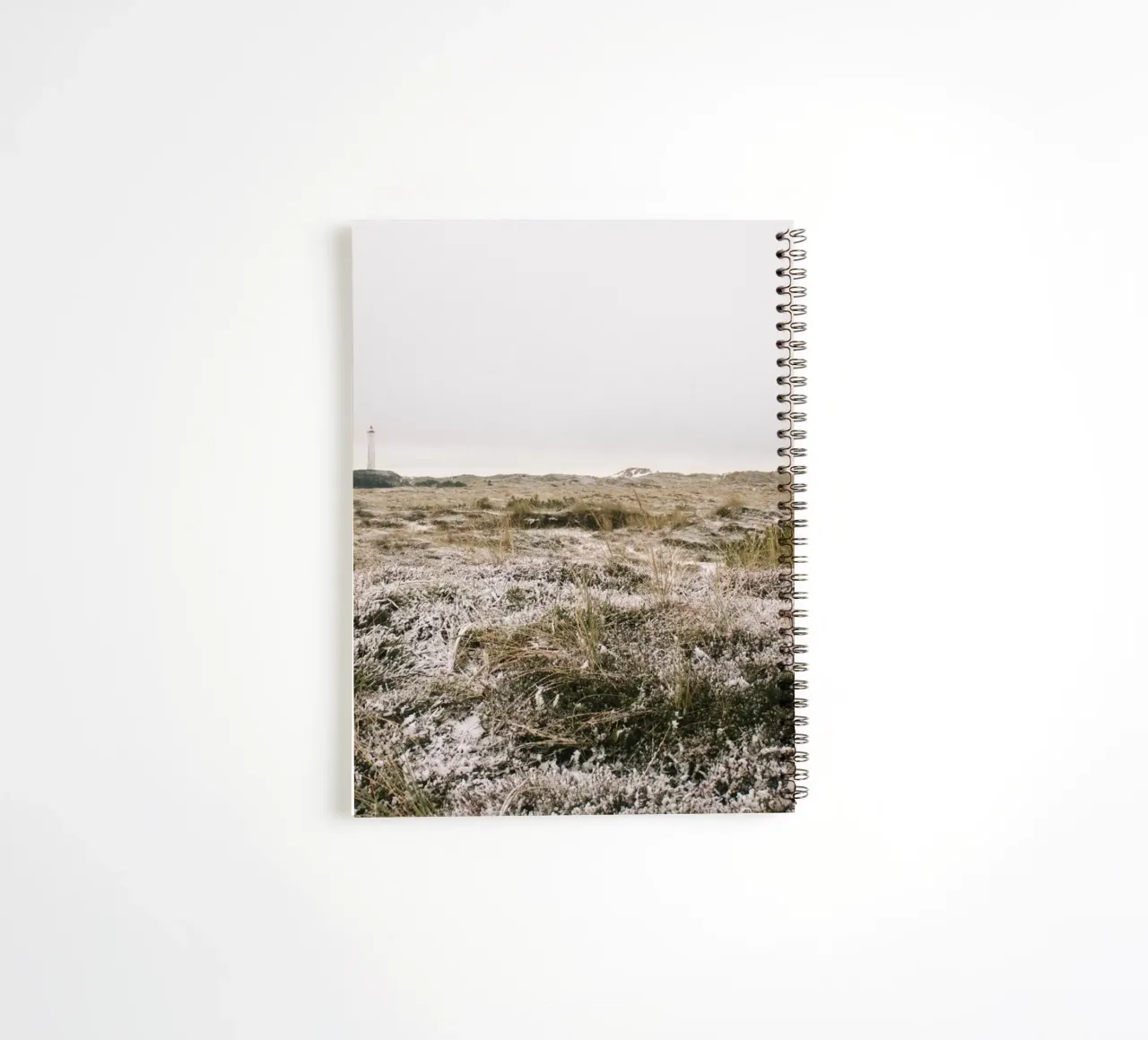 Leuchtturm in Winterlandschaft spiral notebook by The Wild Creative Studio
