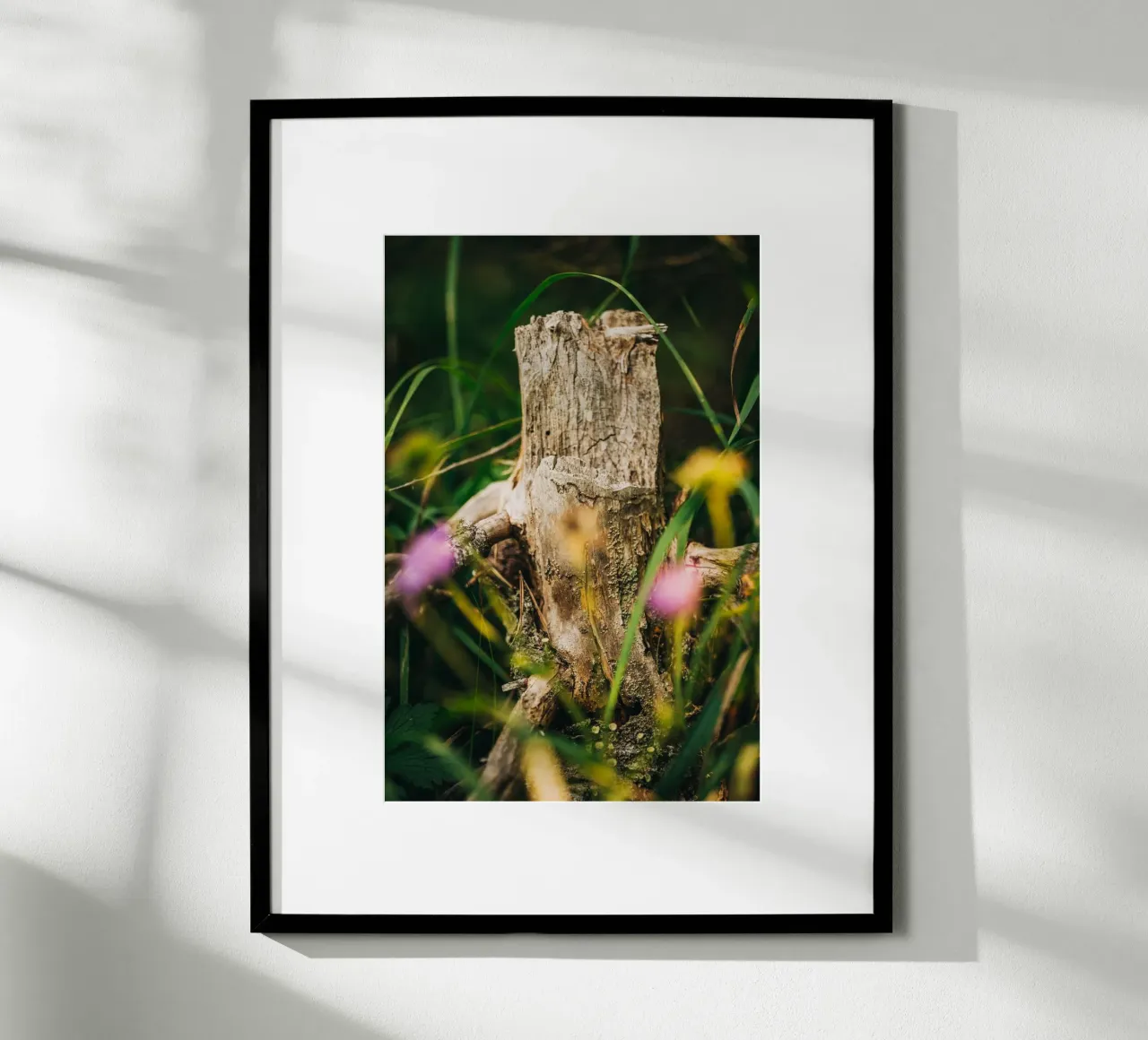 Tree trunk and flowers - nature photography from the Alps poster with plastic frame by Bold and Retro