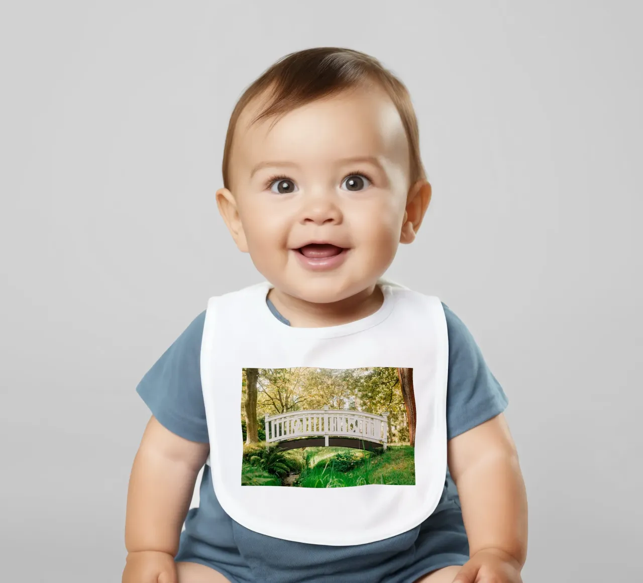 White bridge in the forest - summer idyll by the stream baby bib by Bold and Retro