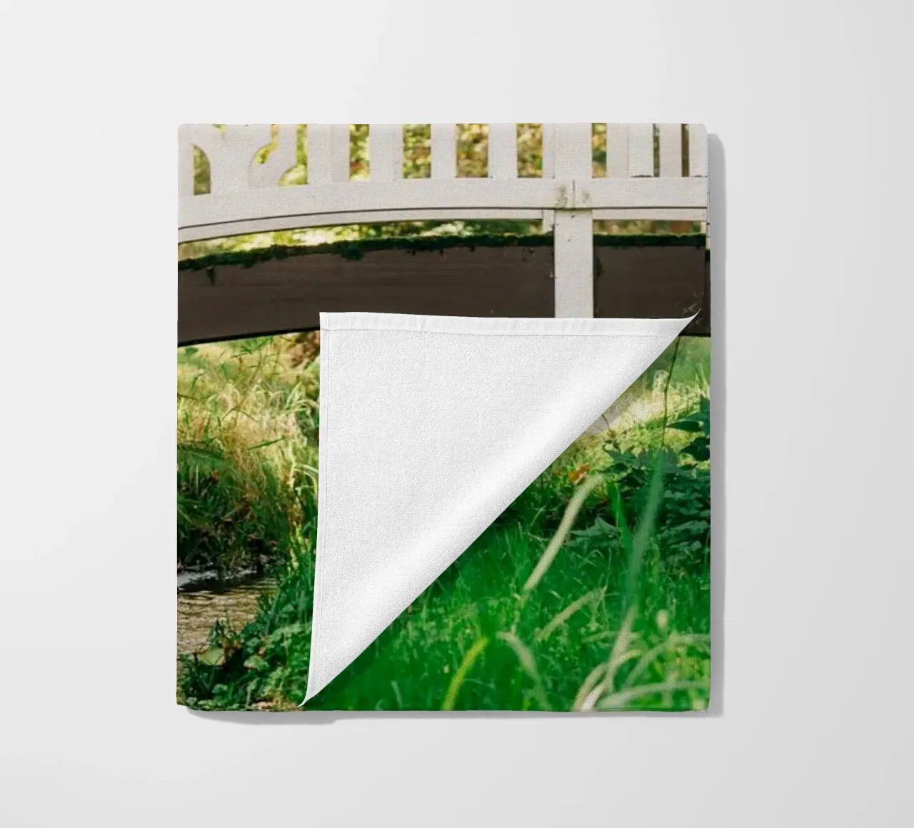 White bridge in the forest - summer idyll by the stream beach towel by Bold and Retro