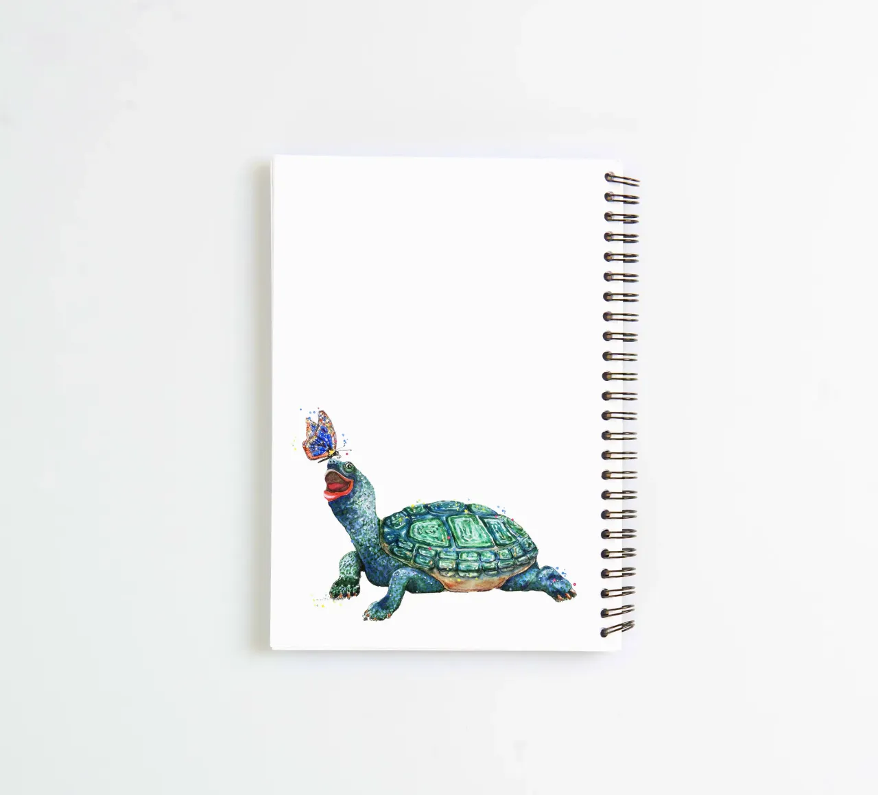 Turtle playing with a Butterfly spiral notebook by Illustration Raissa Oltmanns