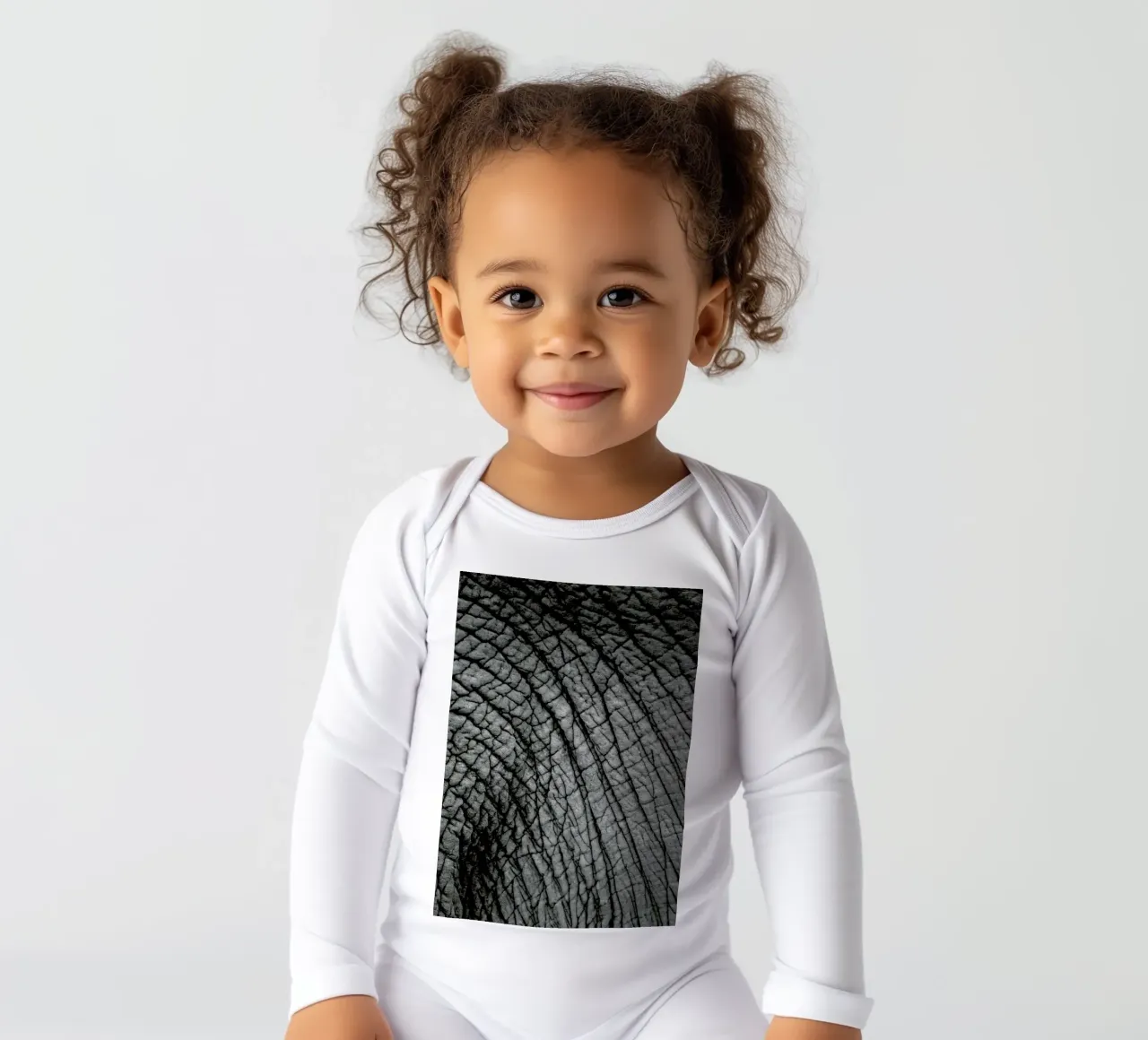 Nambithi Elephant 02 long-sleeve baby romper by Shot By Clint