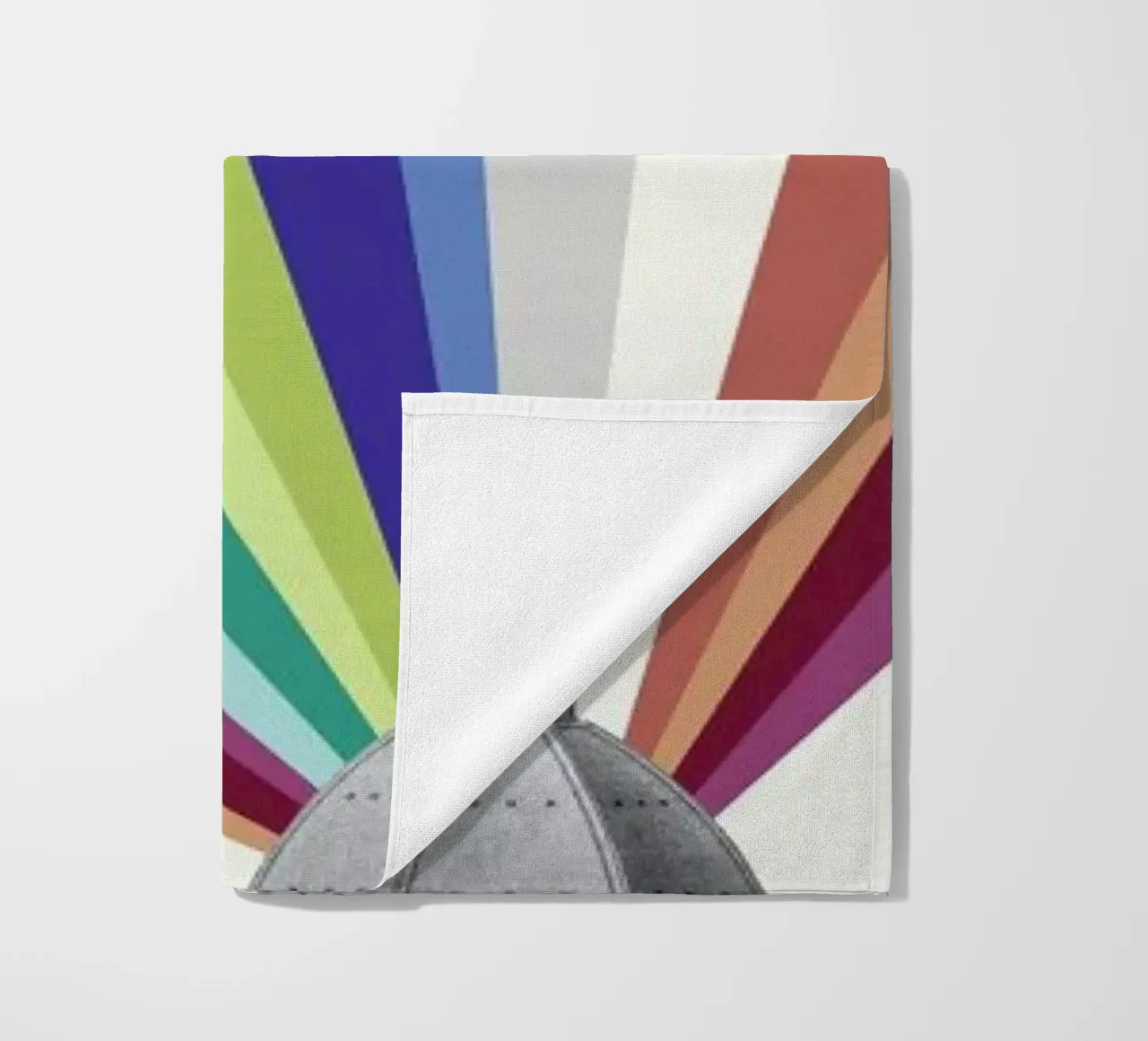 Tower Rainbow beach towel by The Gently Unfurling Sneak