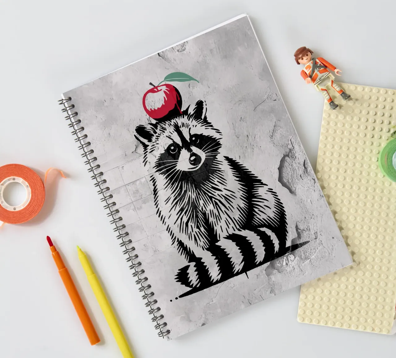 Raccoon with apple - Playful stencil design spiral notebook by namosh