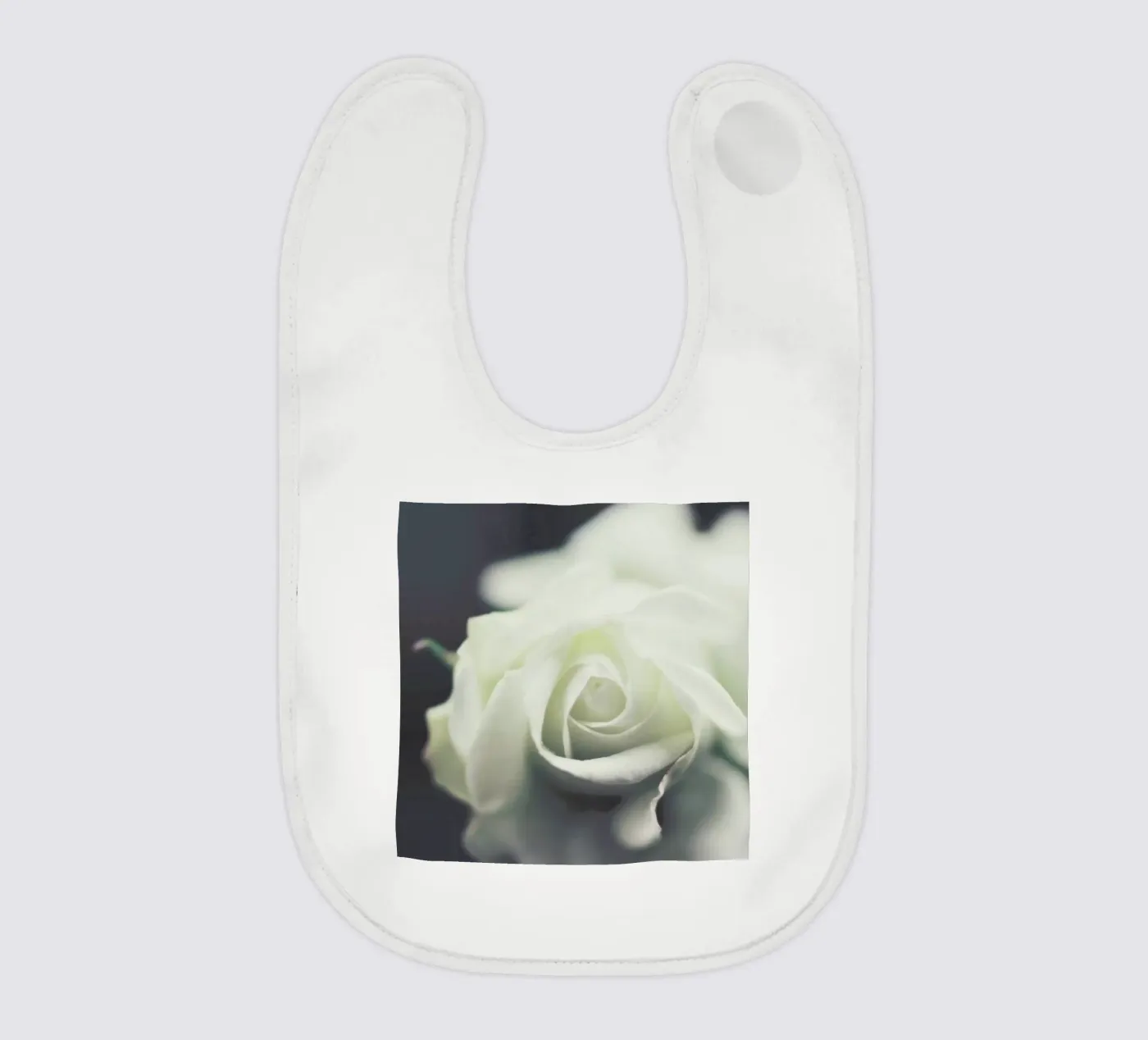 Ivory baby bib by Ingrid Beddoes