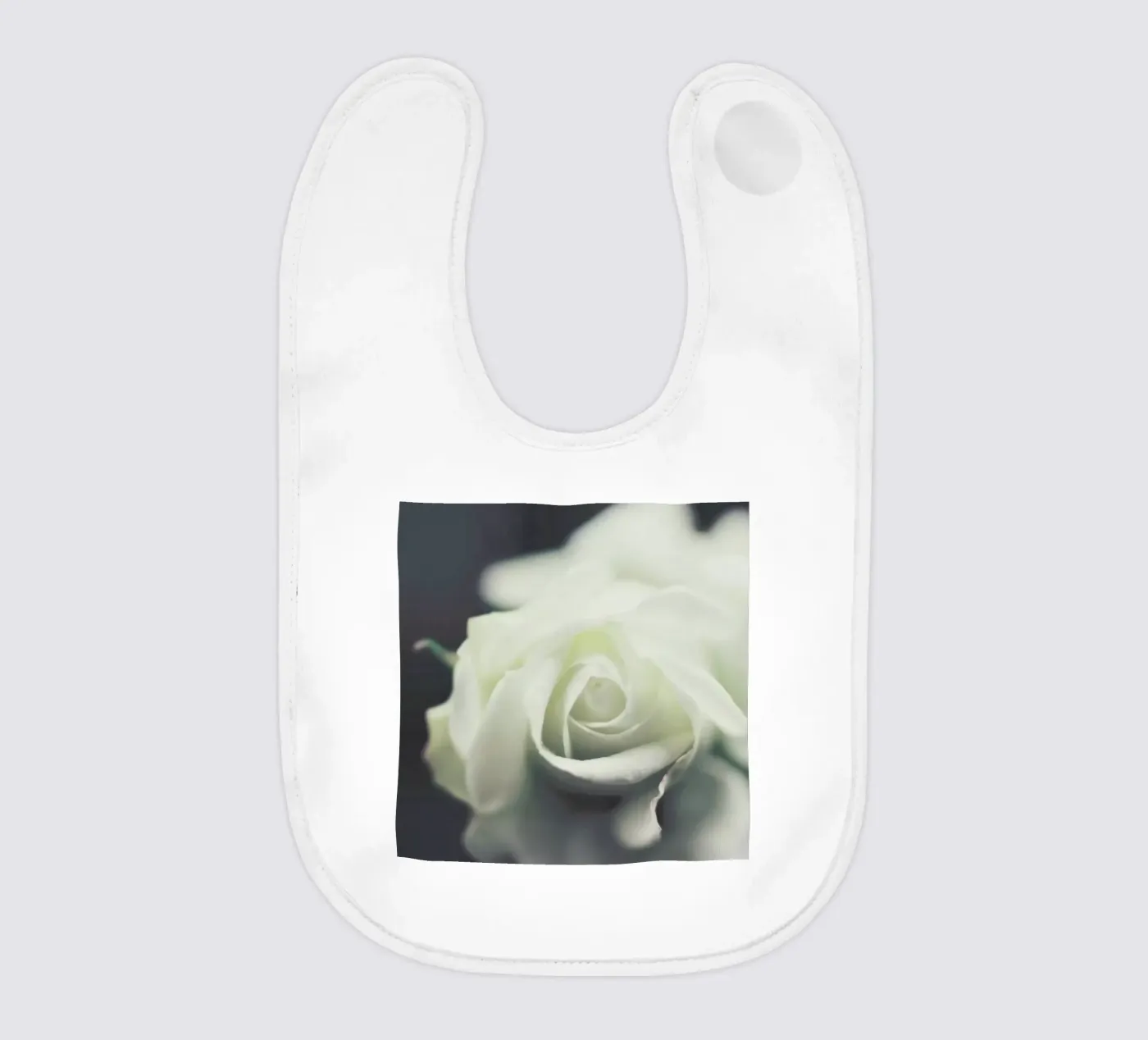 Ivory baby bib by Ingrid Beddoes