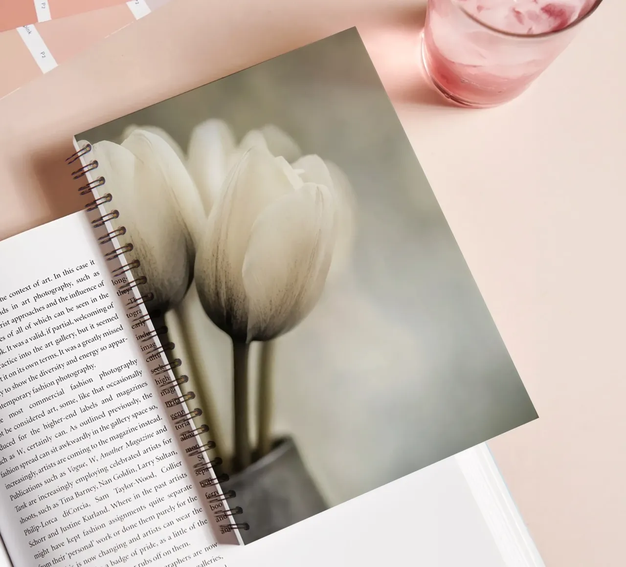 A vase with tulips in soft colours spiral notebook by Imagine