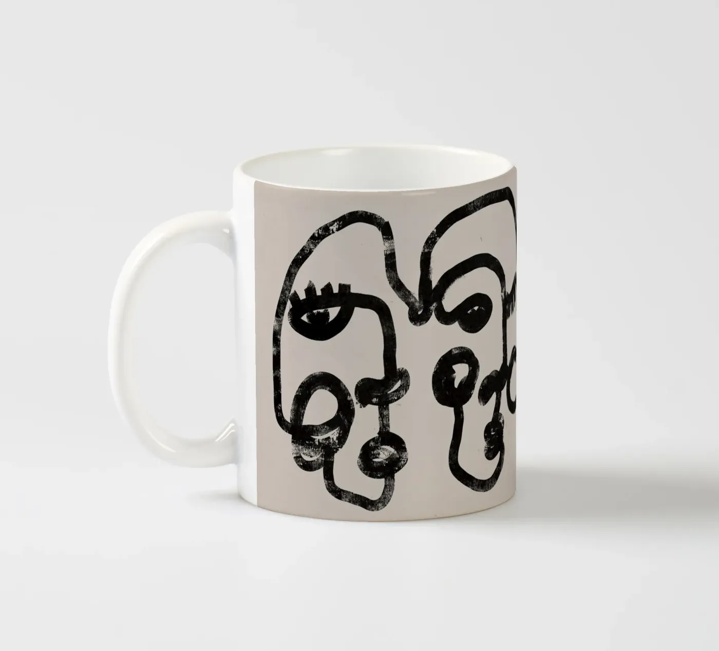 Four Faces ceramic mug by treechild