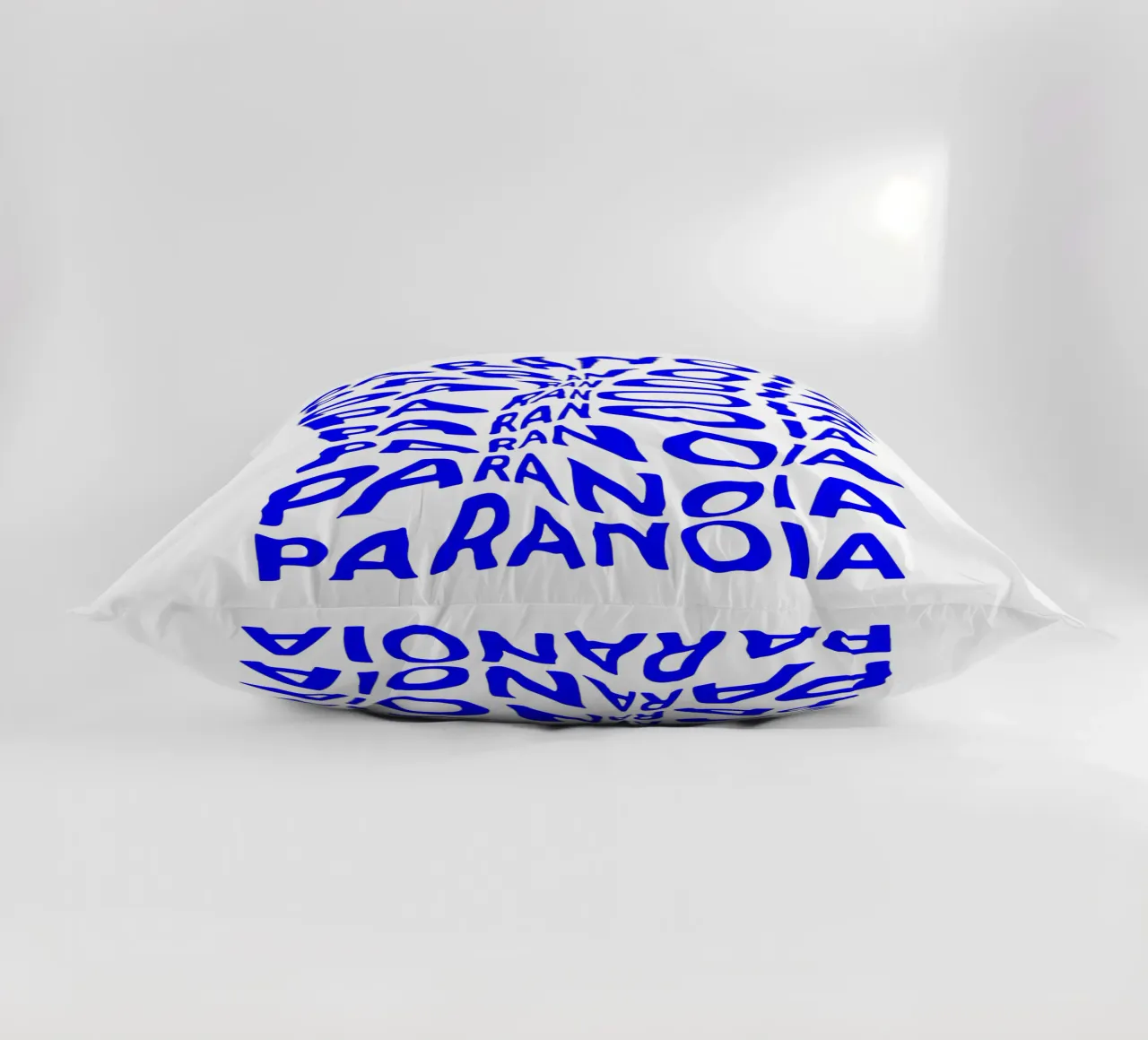 paranoia, optical illusion of liquid typography, statement l decorative cushion by The True Type