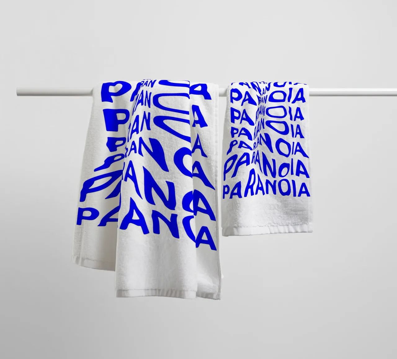 paranoia, optical illusion of liquid typography, statement l towel by The True Type
